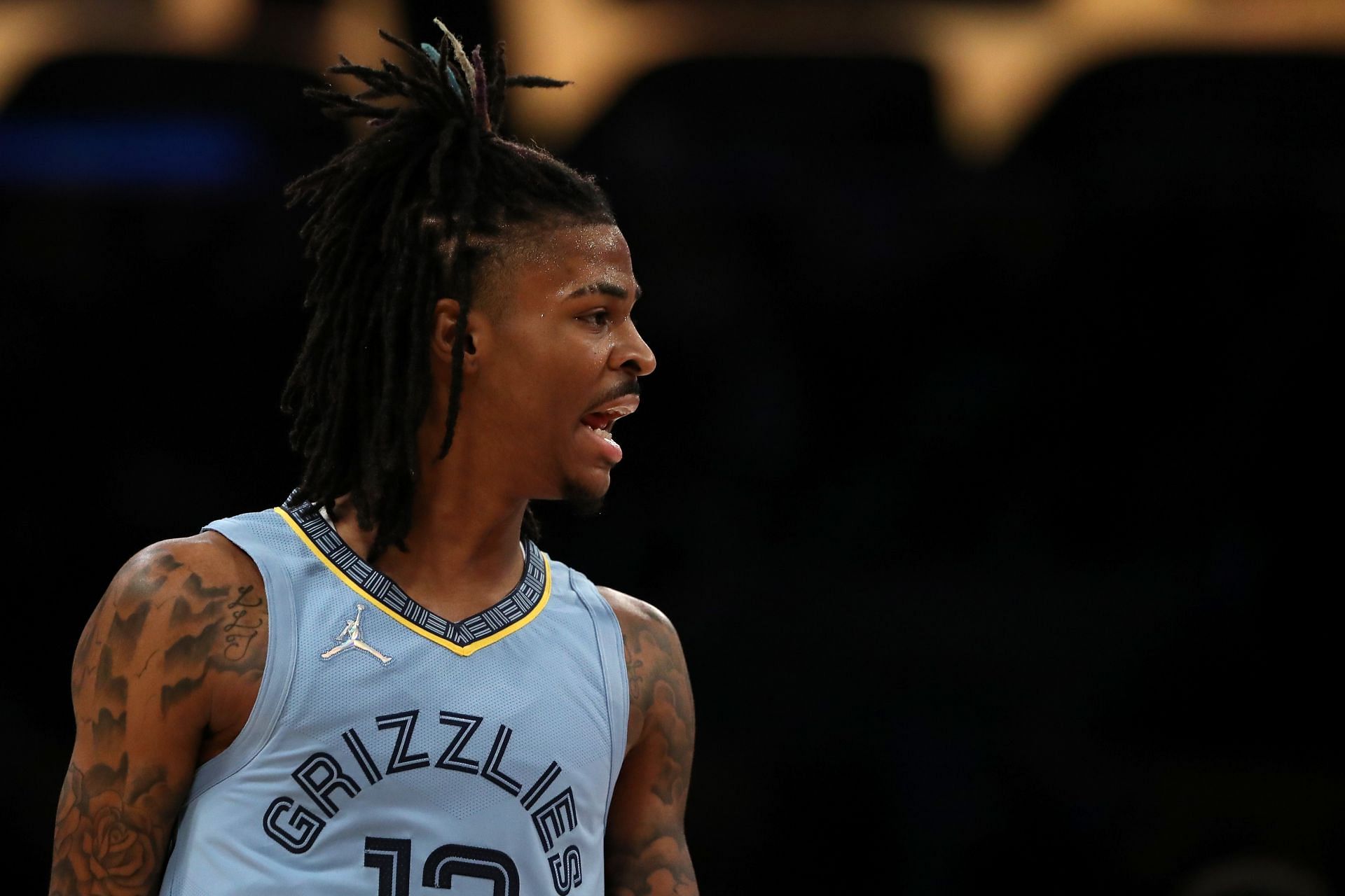 Ja Morant #12 of the Memphis Grizzlies reacts to a play during the first quarter against the Los Angeles Lakers at Crypto.com Arena on January 09, 2022 in Los Angeles, California.