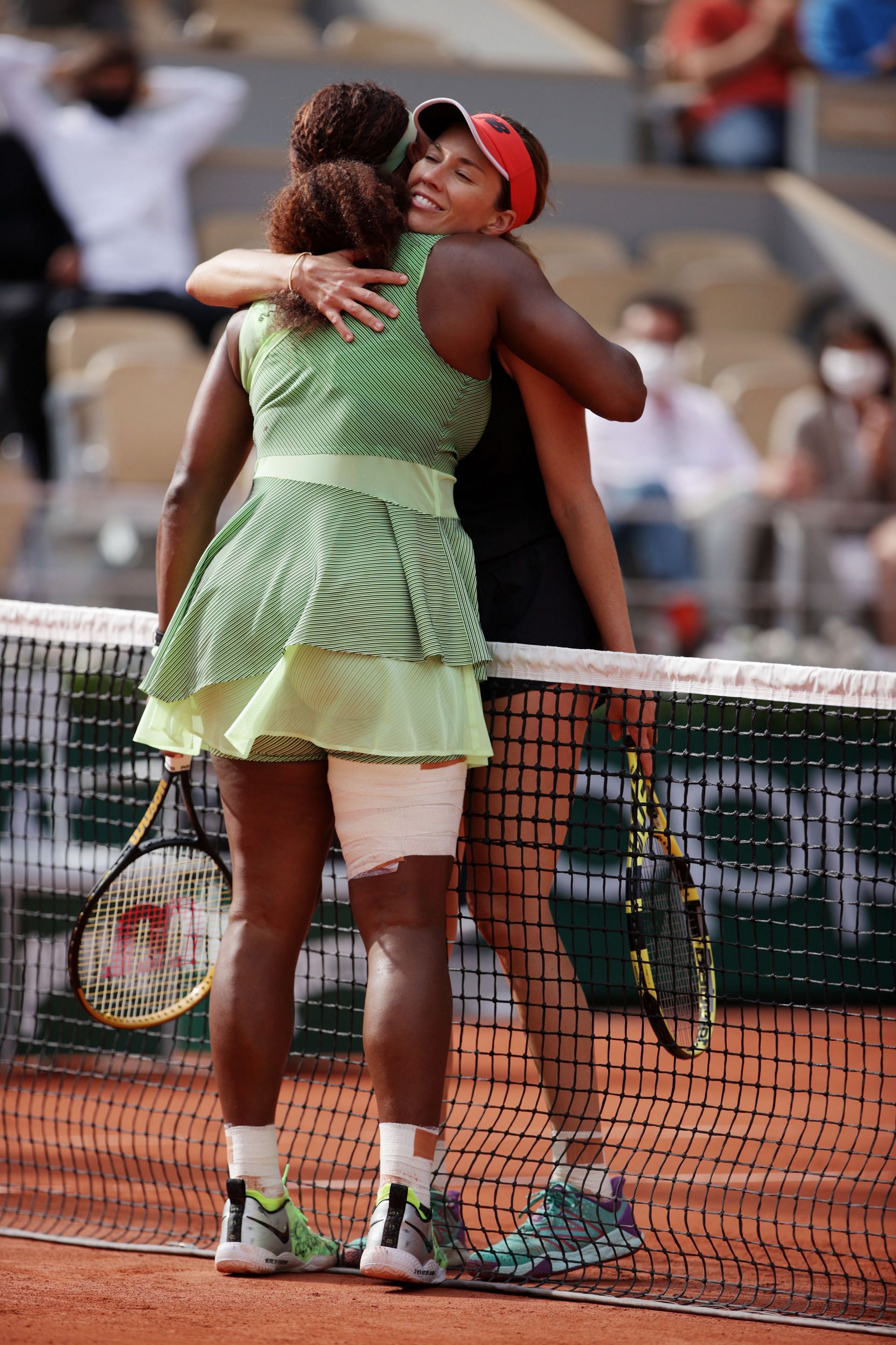 Serena Williams (L) &amp; Danielle Collins embrace after their third-round match at 2021 French Open