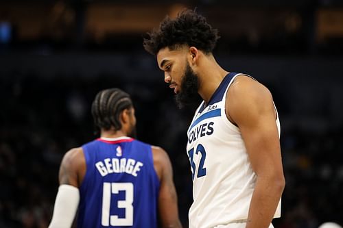 Paul George of the LA Clippers and Karl-Anthony Towns (in focus) of the Minnesota Timberwolves