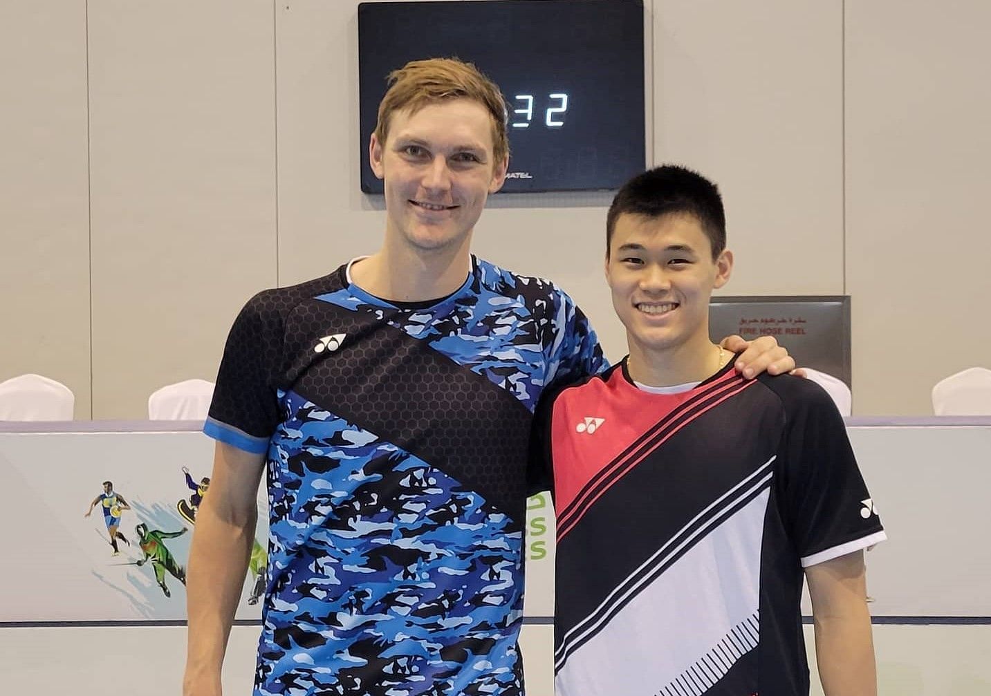 Canada&#039;s Brian Yang (right) with Tokyo Olympic champion Viktor Axelsen