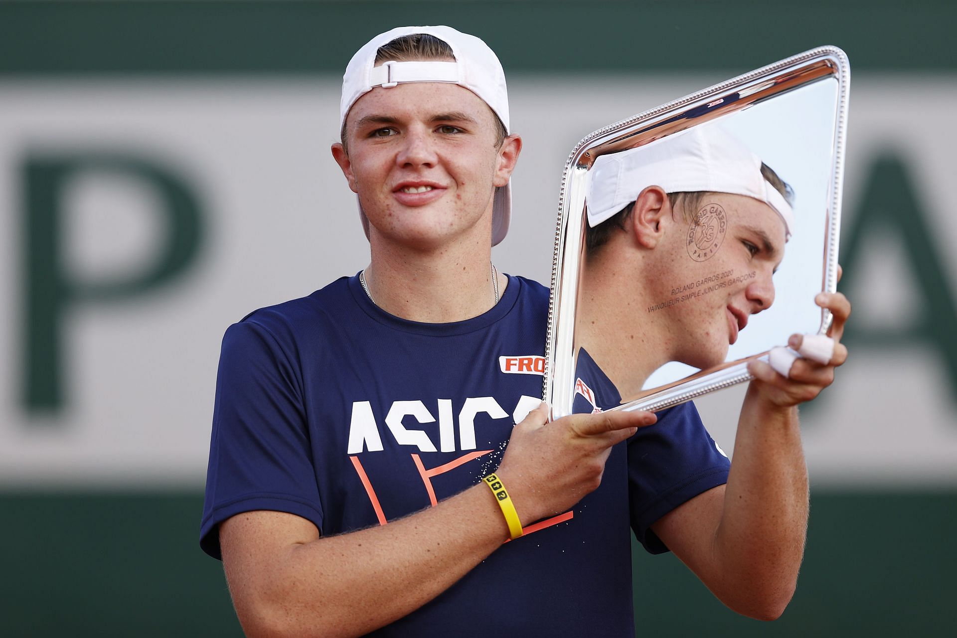 Dominic Stricker with his boys&#039; singles trophy at Roland Garros 2020