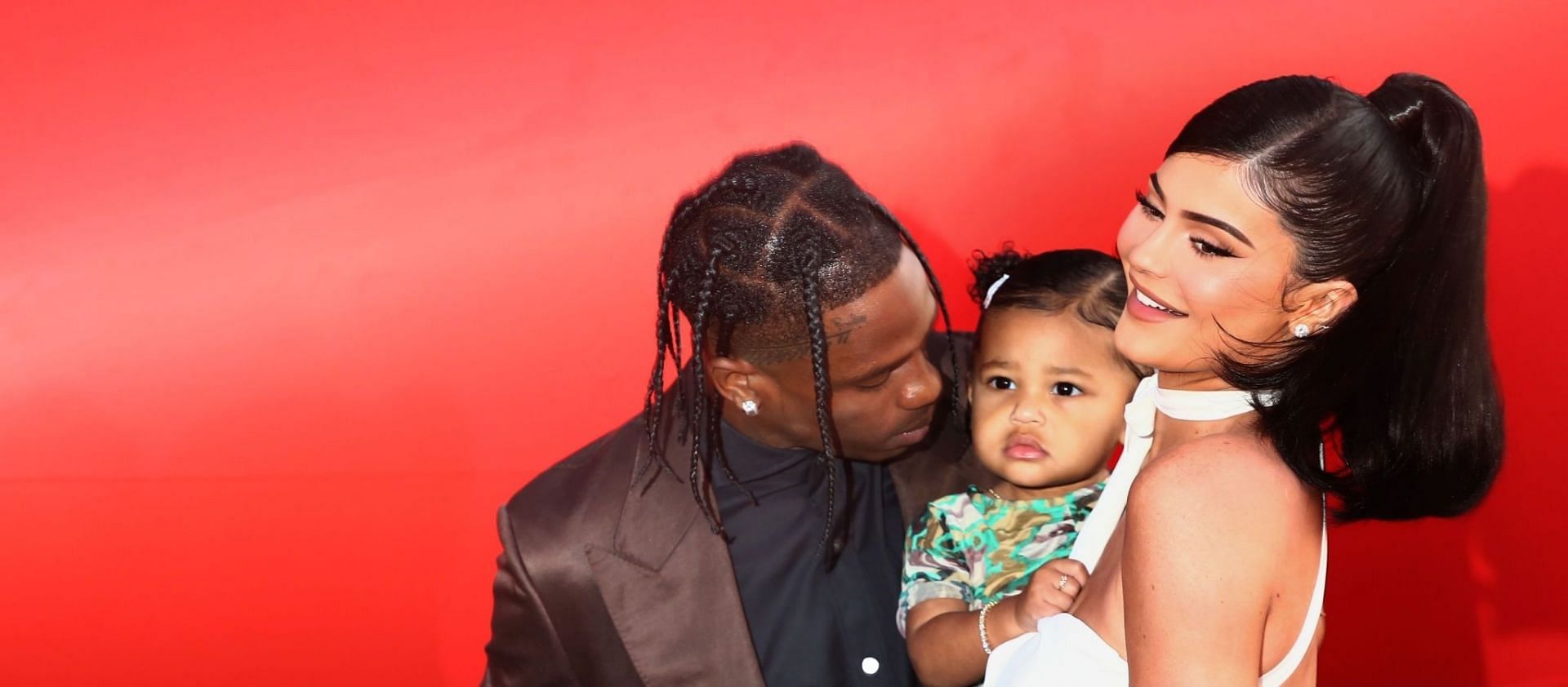 Kylie Jenner with Travis Scott and their daughter Stormi (Image via Tommaso Boddi/Getty Images)