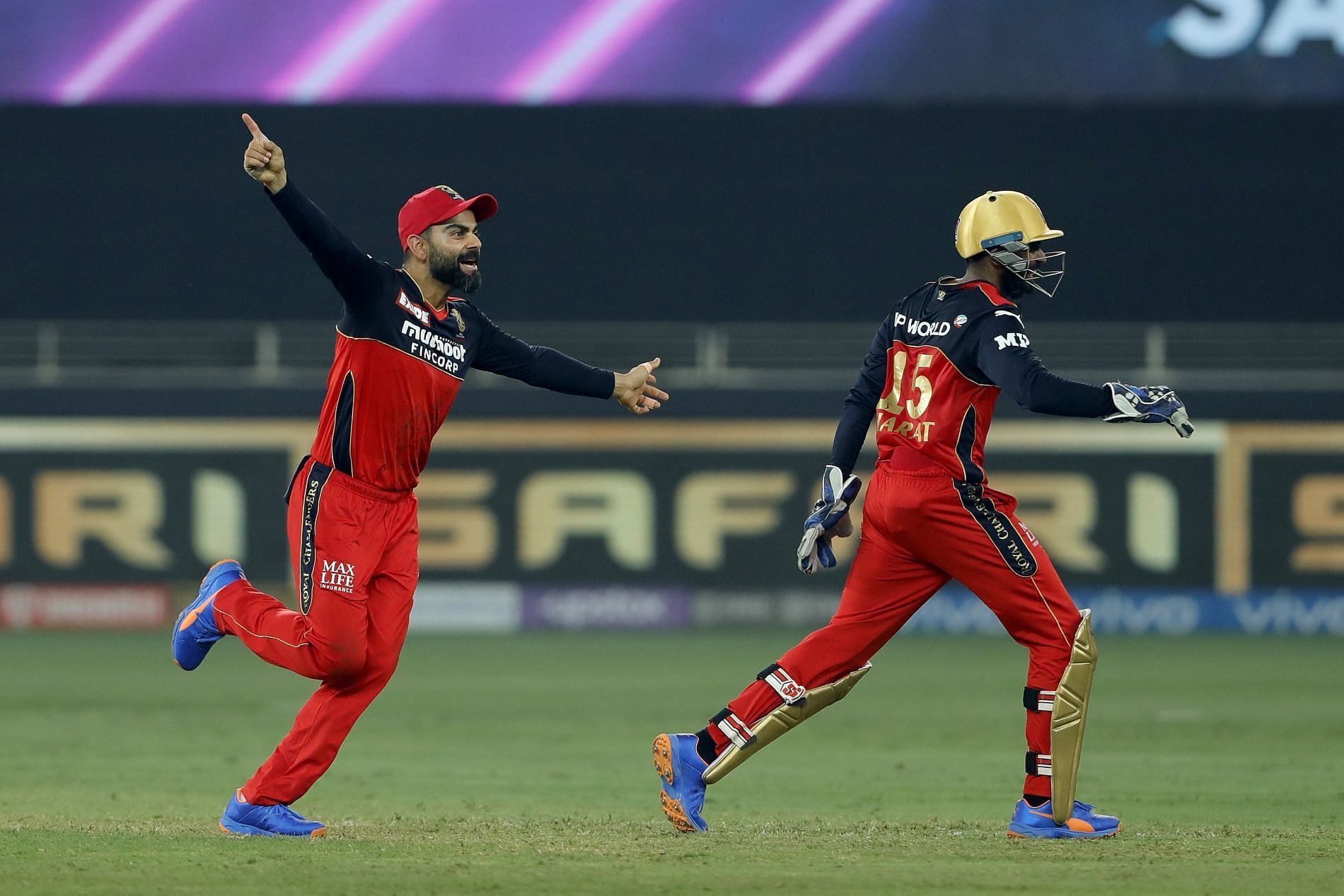 Virat Kohli (left) celebrates a wicket during IPL 2021. Pic: IPLT20.COM