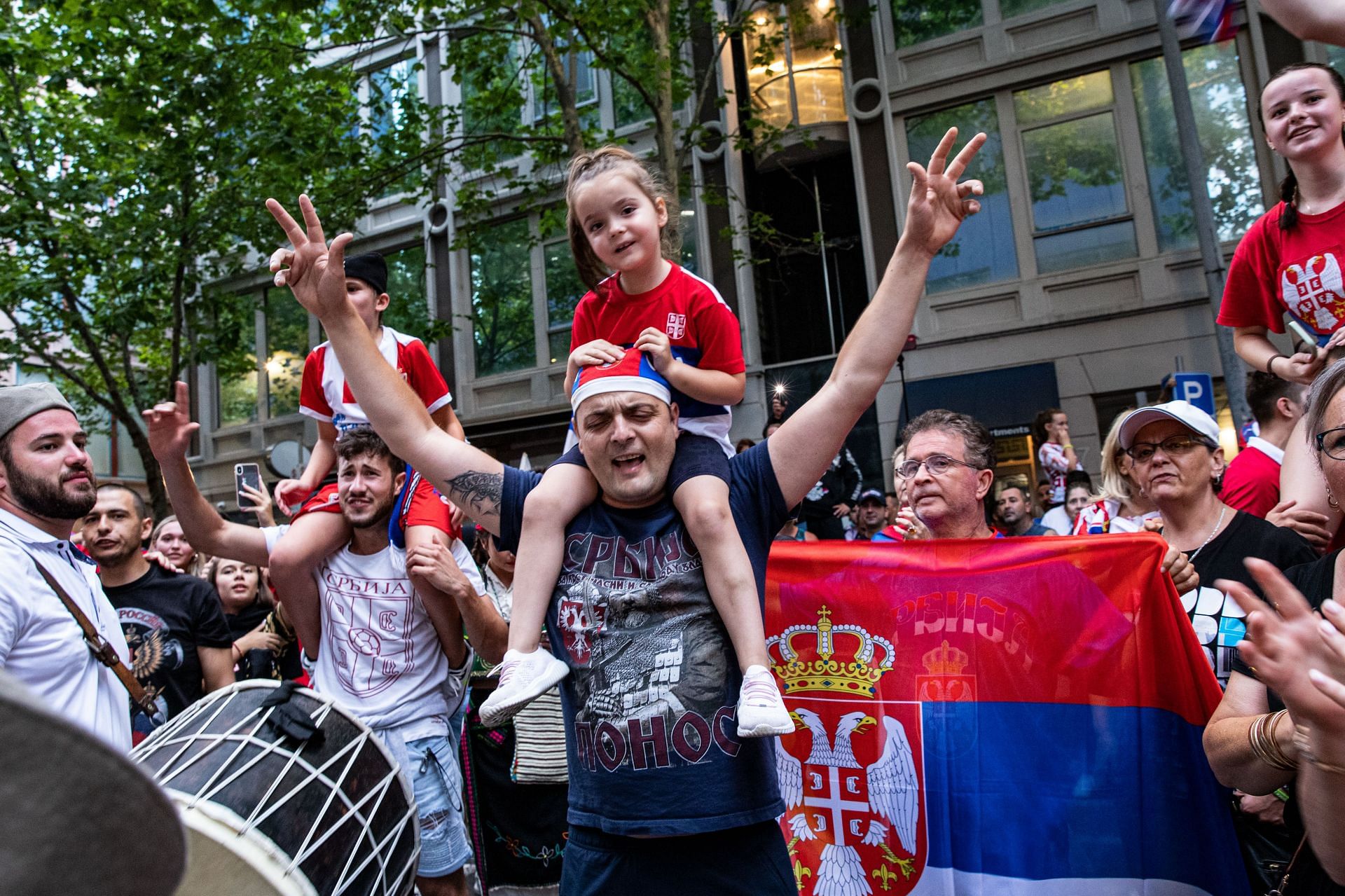 Novak Djokovic's fans celebrate on Collins Street after he won his court case