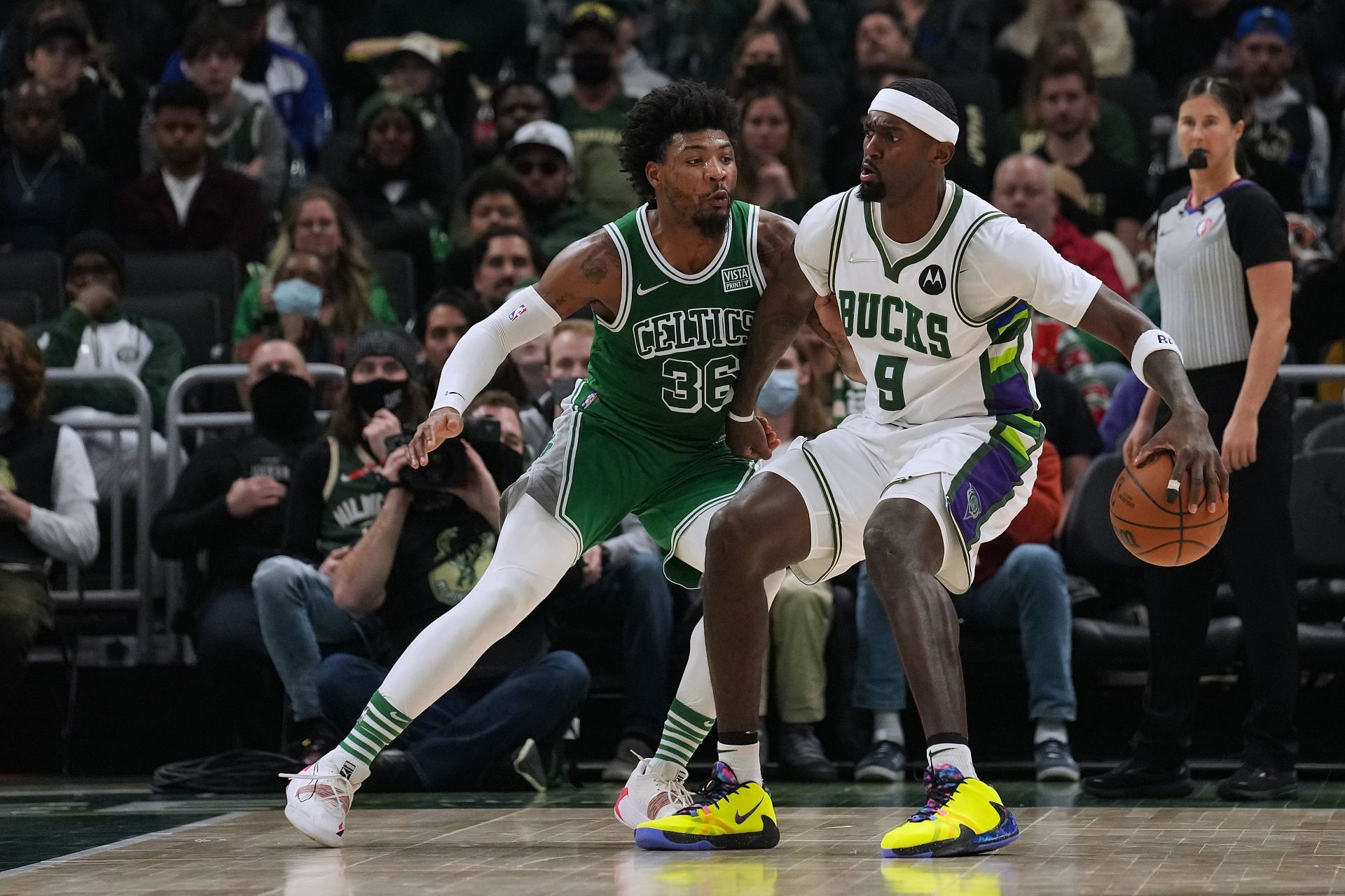 Marcus Smart defends against Bobby Portis
