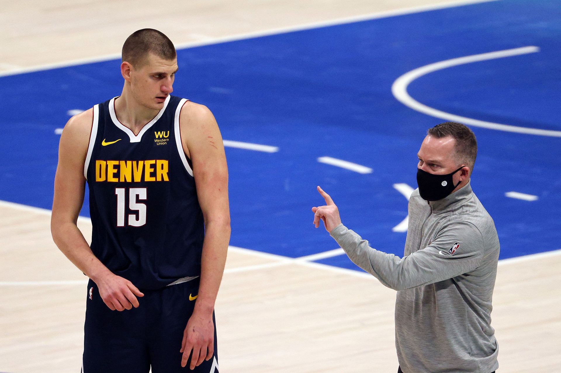 Nikola Jokic and Mike Malone of the Denver Nuggets.