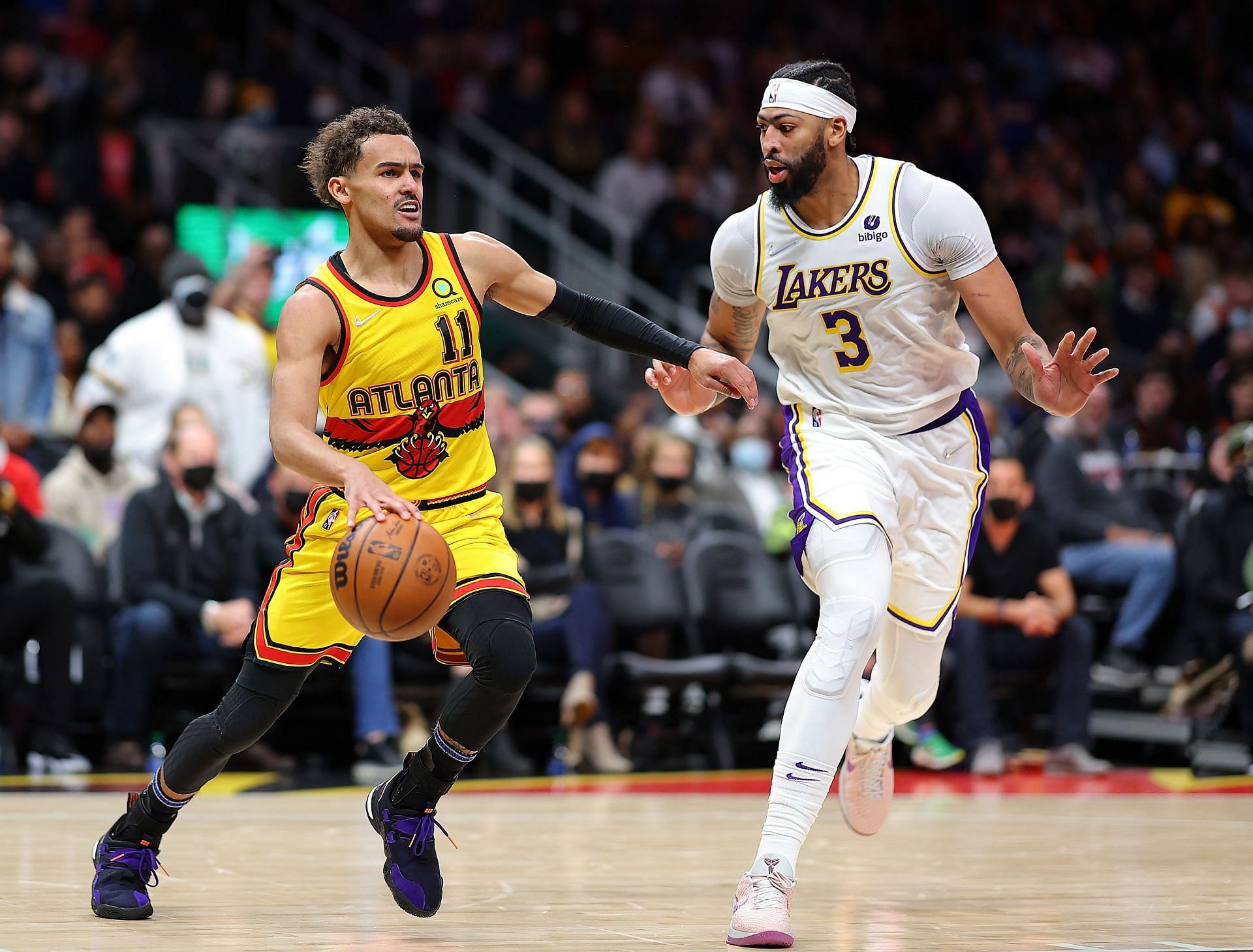 Trae Young #11 of the Atlanta Hawks drives against Anthony Davis #3 of the Los Angeles Lakers during the second half at State Farm Arena on January 30, 2022 in Atlanta, Georgia.