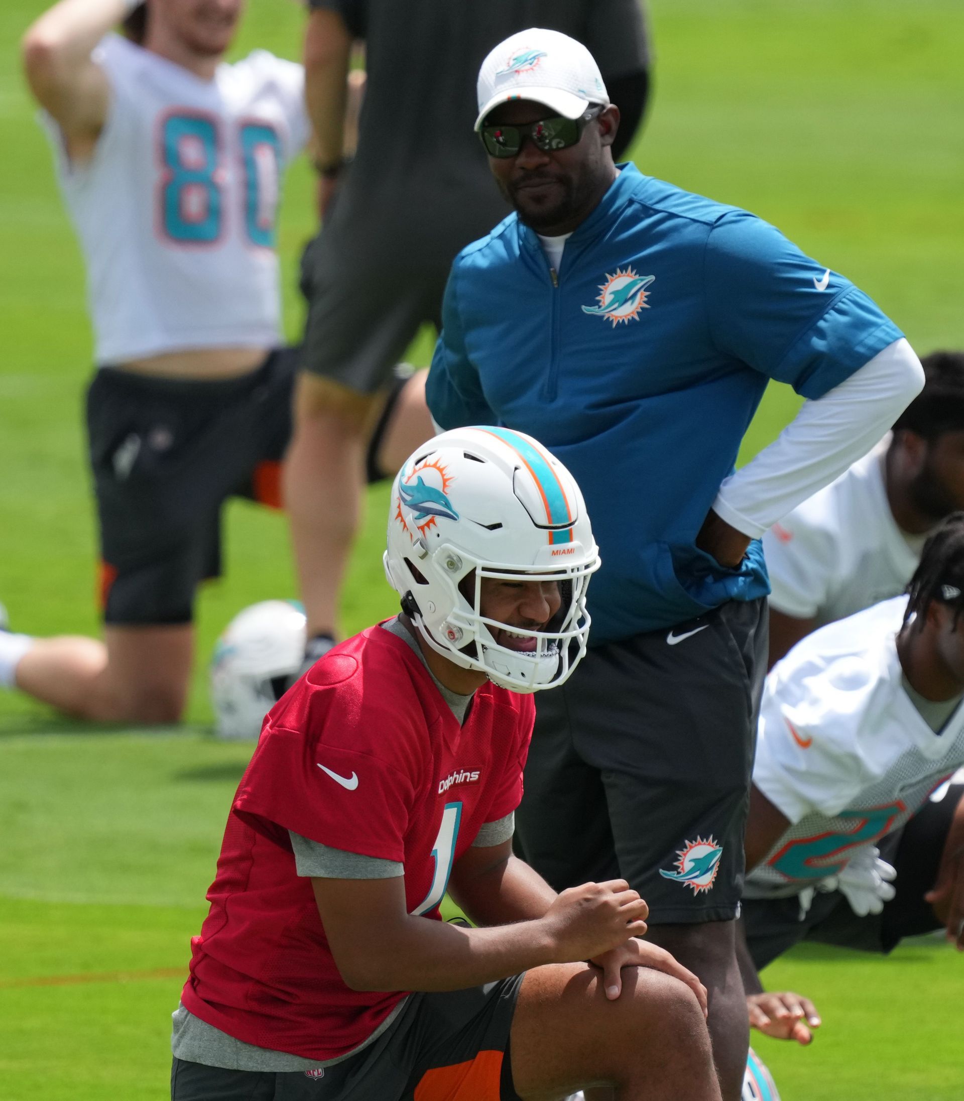 Miami Dolphins&#039; Tua Tagovailoa and former head coach Brian Flores