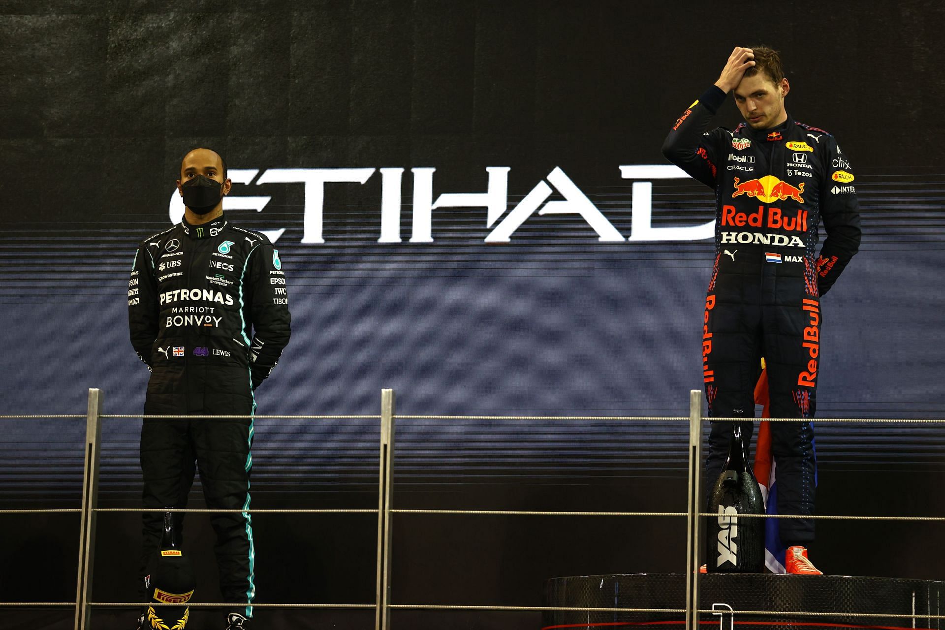 Lewis Hamilton (left) and Max Verstappen (right) at the Abu Dhabi Grand Prix podium (Photo by Bryn Lennon/Getty Images)