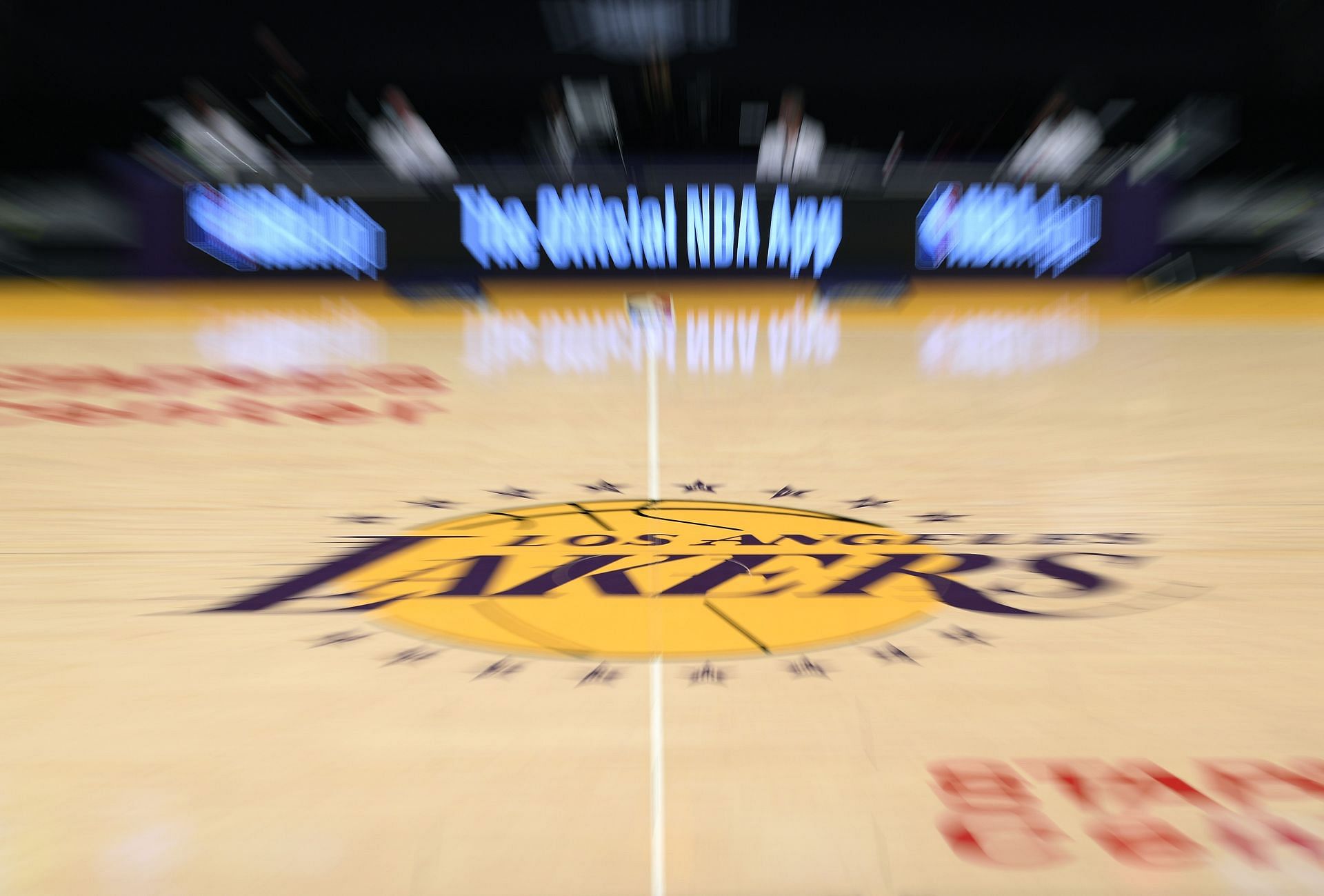 Lakers&#039; logo seen on the basketball court during an NBA game.