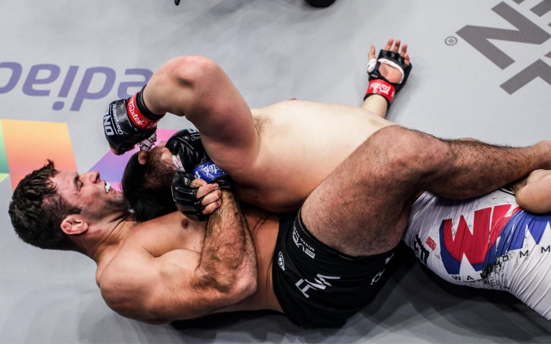 ONE Championship heavyweight and jiu-jitsu icon Marcus &#039;Buchecha&#039; Almeida (bottom) is one of the best grapplers in MMA today. (Image courtesy of ONE Championship)