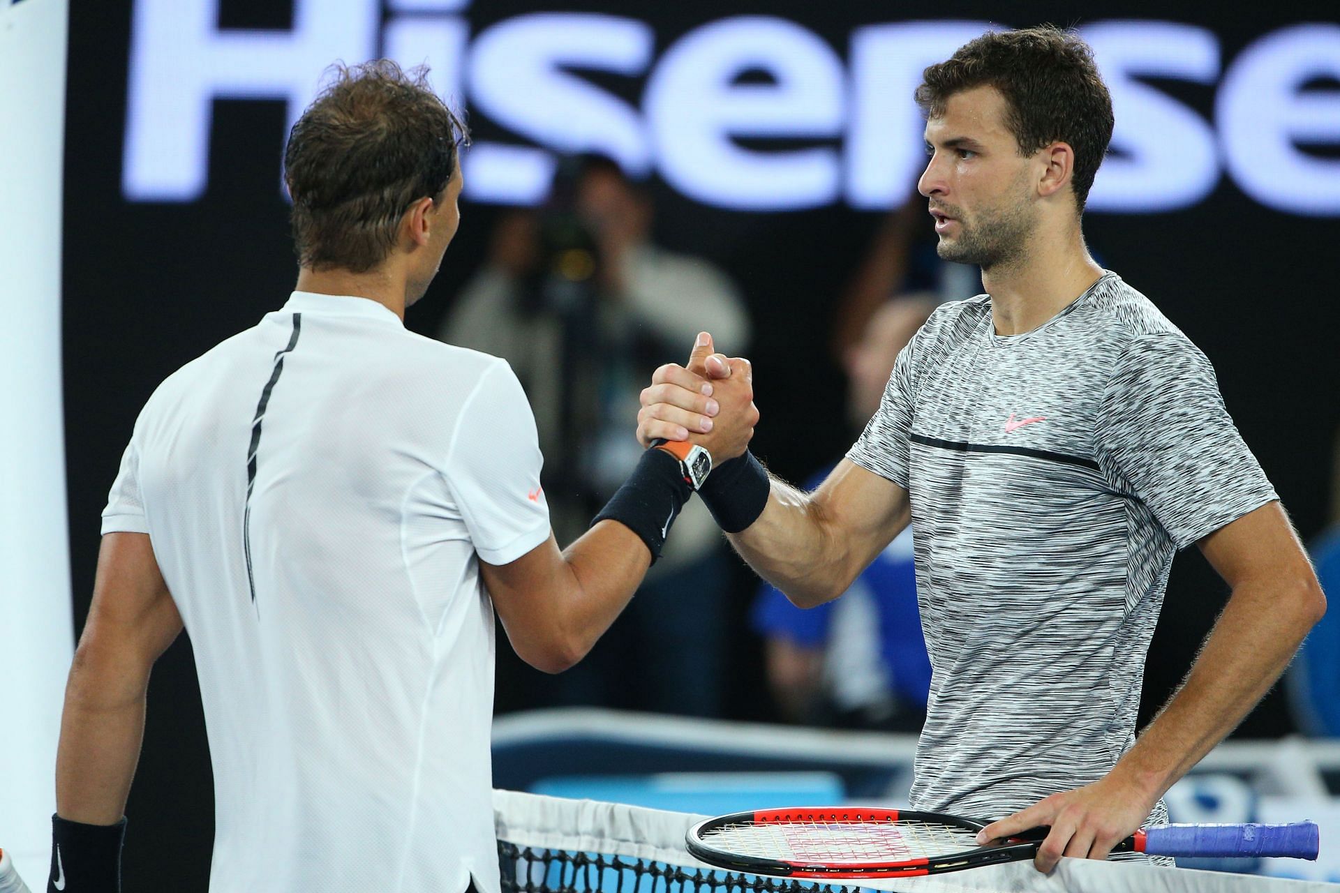 Rafael Nadal and Grigor Dimitrov embrace at the 2017 Australian Open