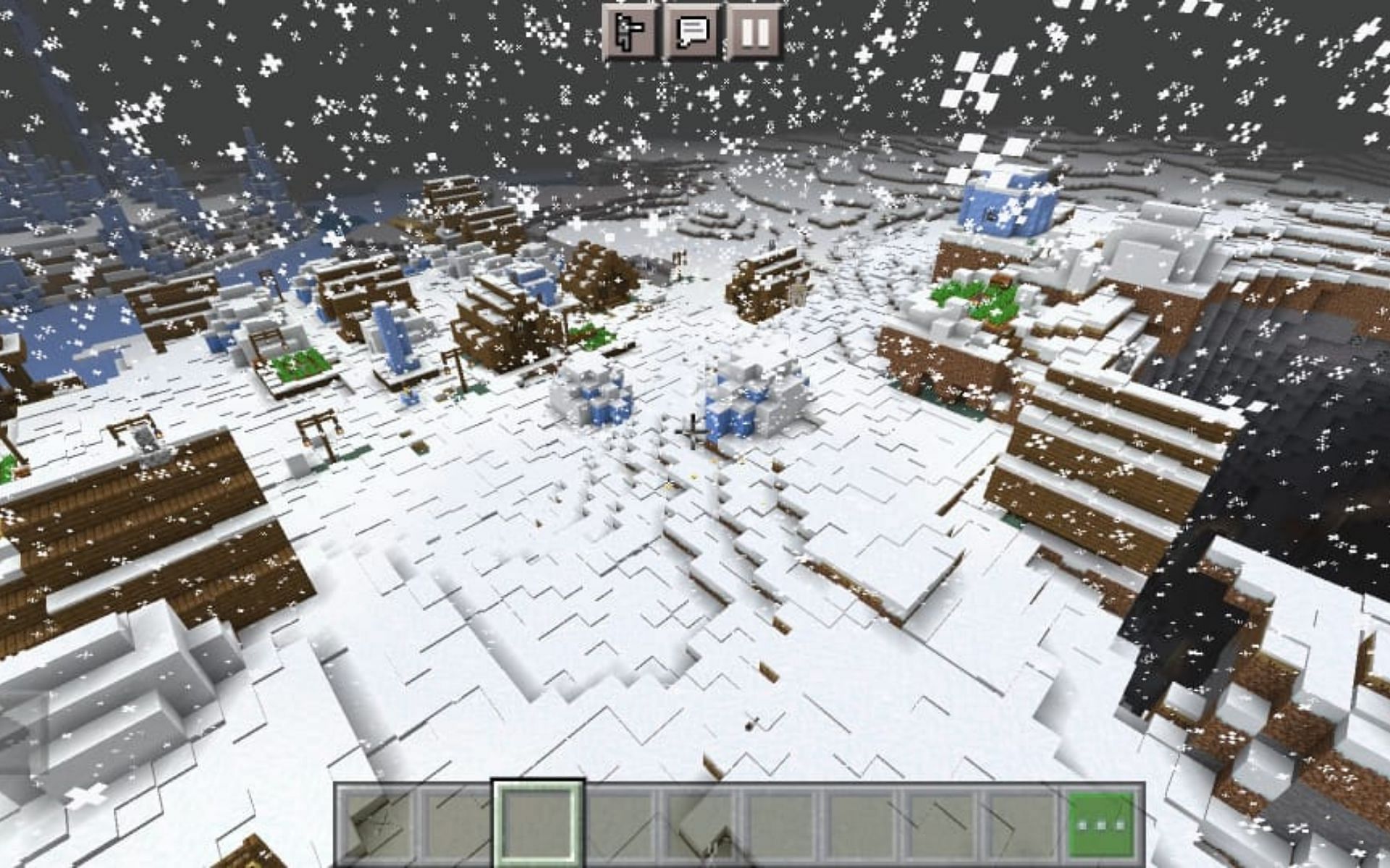 Snow village with a massive cave opening (Image via Minecraft)