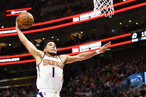 Devin Booker #1 of the Phoenix Suns dunks.