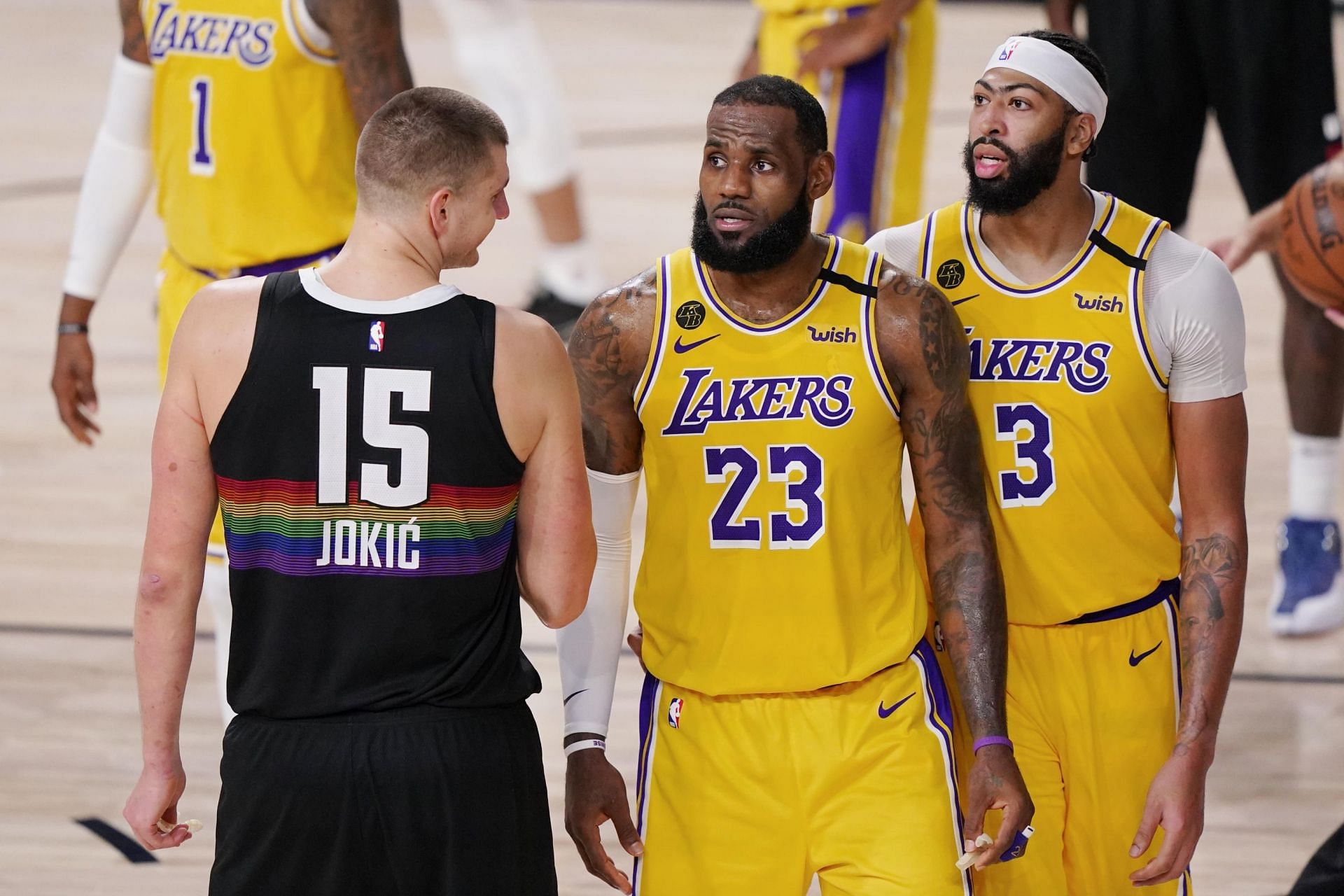 LeBron James and Anthony Davis of the LA Lakers against Nikola Jokic of the Denver Nuggets