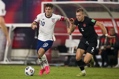 Christian Pulisic (left) and Alistair Johnston (right) during Canada v United States: 2022 World Cup Qualifying