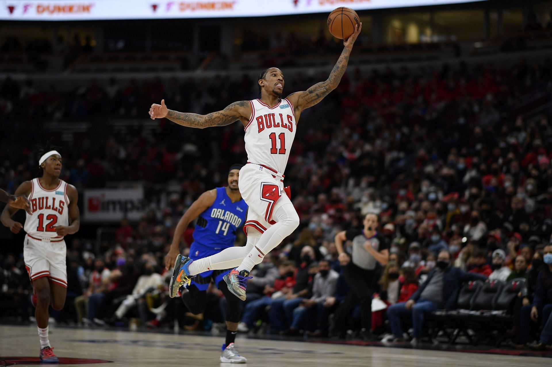 DeMar DeRozan of the Chicago Bulls leaps to catch a pass against the Orlando Magic at United Center on Jan. 3 in Chicago, Illinois.