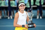 Victoria Jimenez Kasintseva, of Andorra, poses with the championship trophy after winning her Junior Girls' Singles tilte at the 2020 Australian Open at Melbourne Park