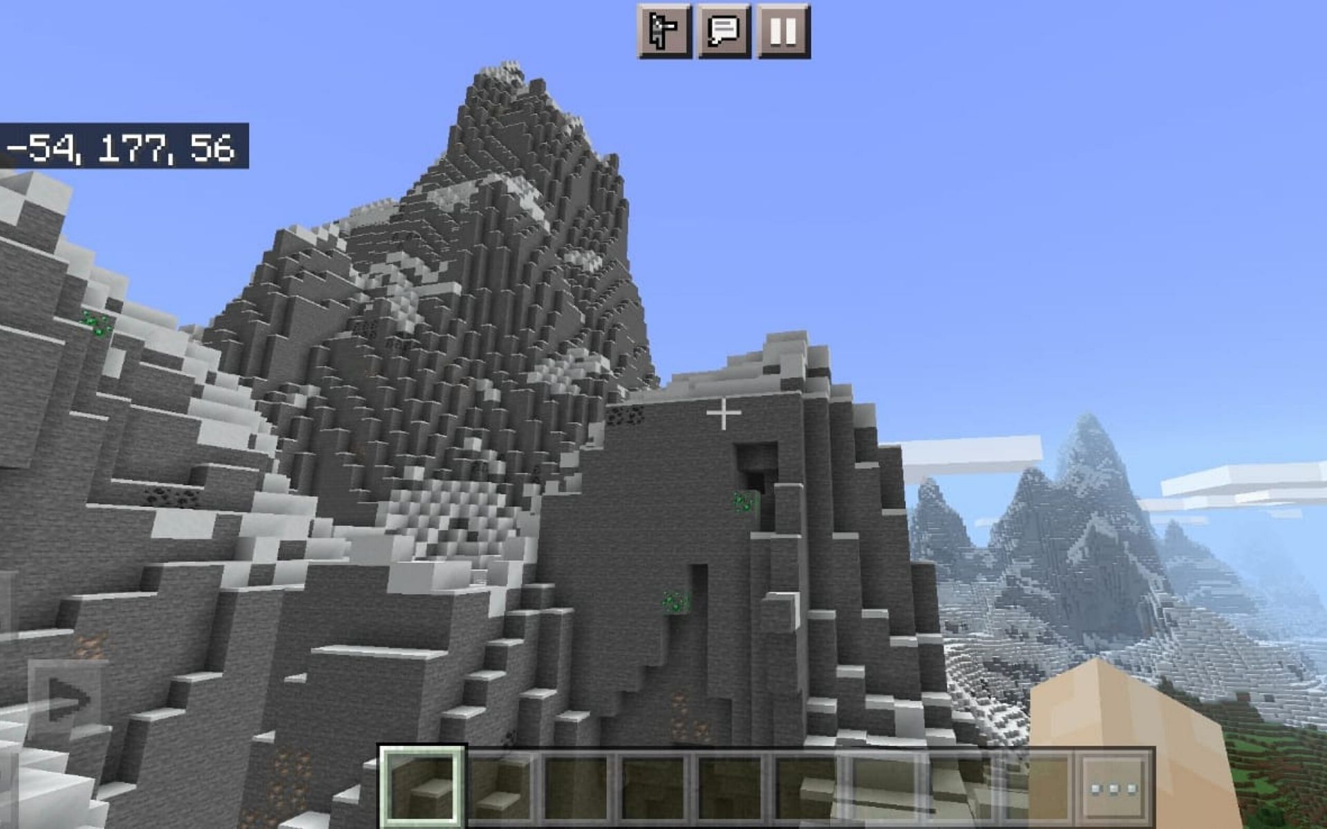 Emeralds embedded in a mountain (Image via Minecraft)