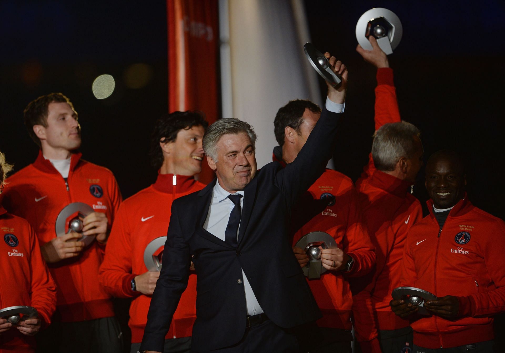 Carlo Ancelotti waves to the fans after a presentation.