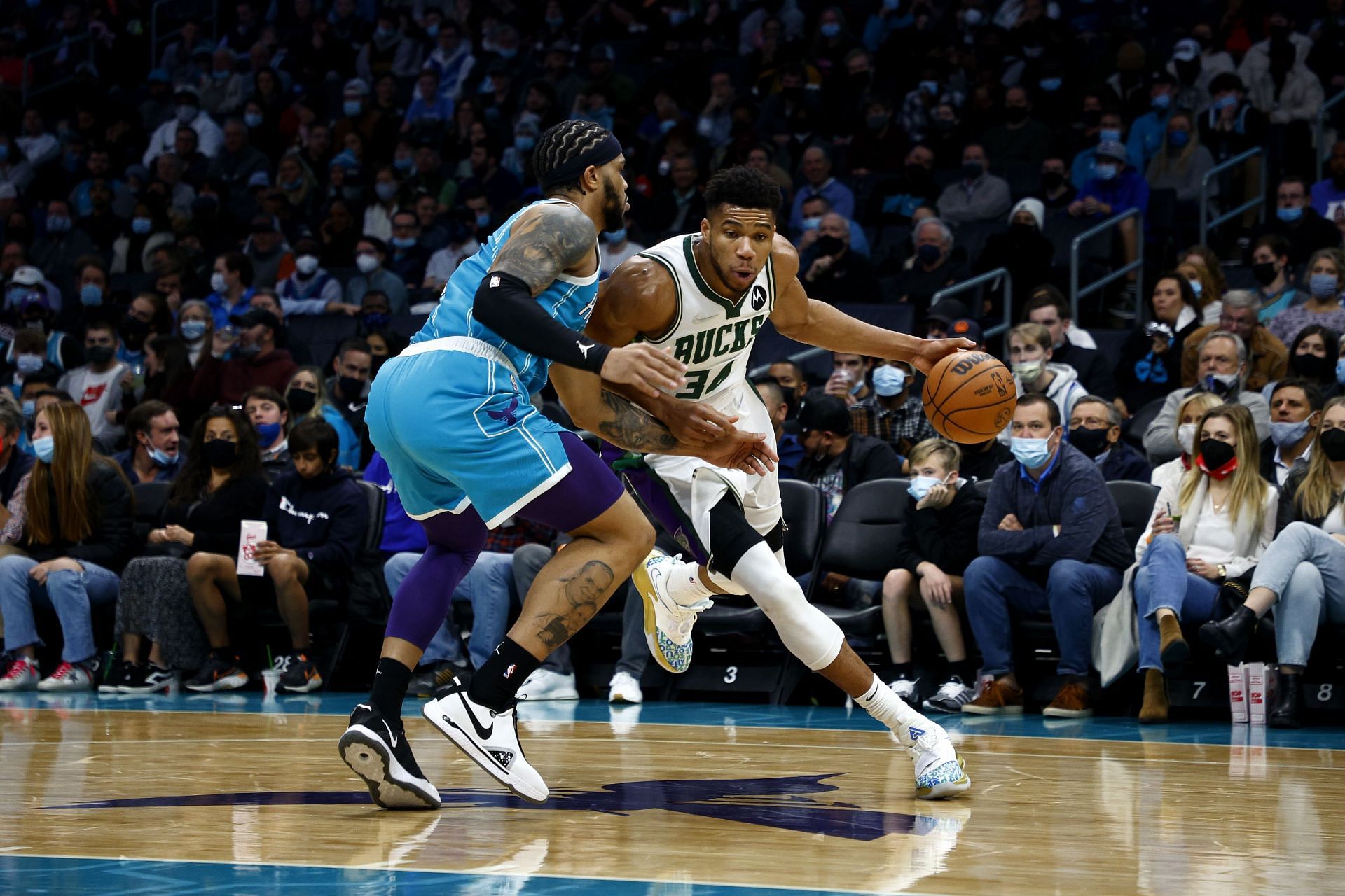 Giannis Antetokounmpo #34 of the Milwaukee Bucks drives to the basket against Miles Bridges #0 of the Charlotte Hornets