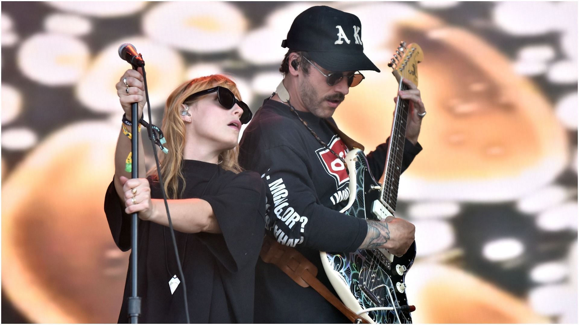 Zoe Manville and John Baldwin Gourley of Portugal. the Man perform during the 2021 BottleRock Napa Valley music festival (Image via Tim Mosenfelder/Getty Images)