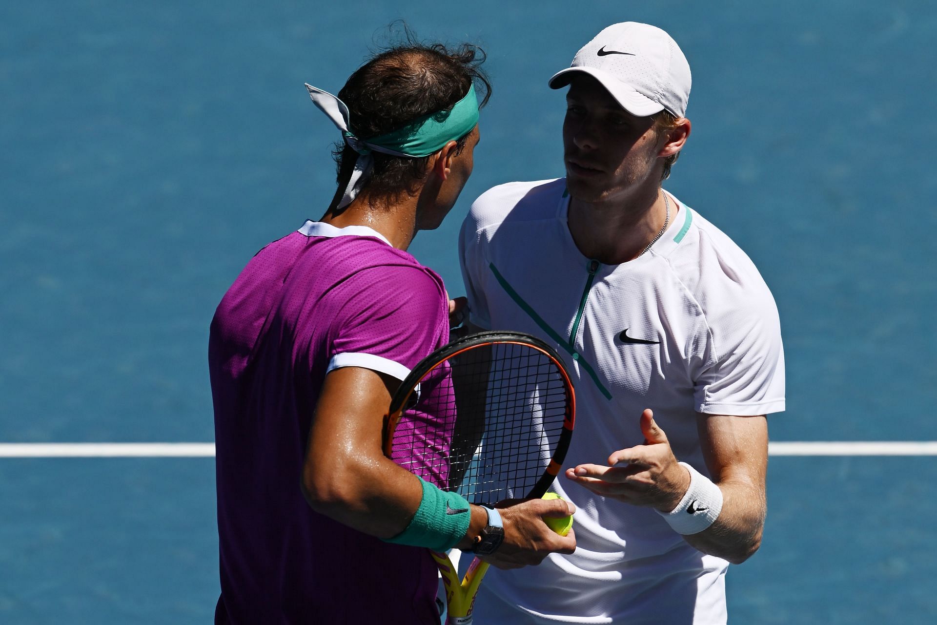 Rafael Nadal and Denis Shapovalov talk during theit 2022 Australian Open quarterfinal