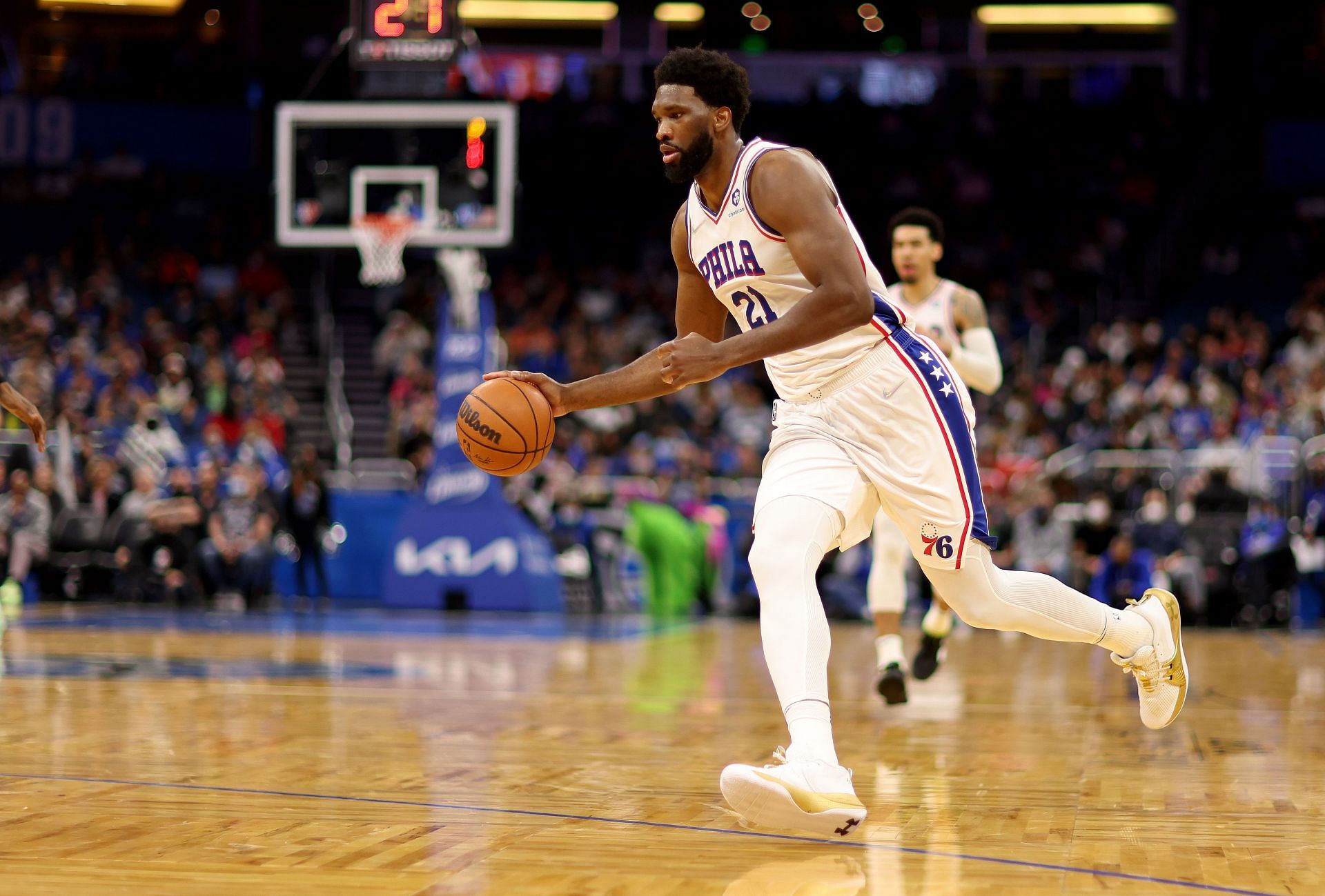 Joel Embiid #21 of the Philadelphia 76ers drives into the basket during a game against the Orlando Magic at Amway Center on January 5, 2022 in Orlando, Florida