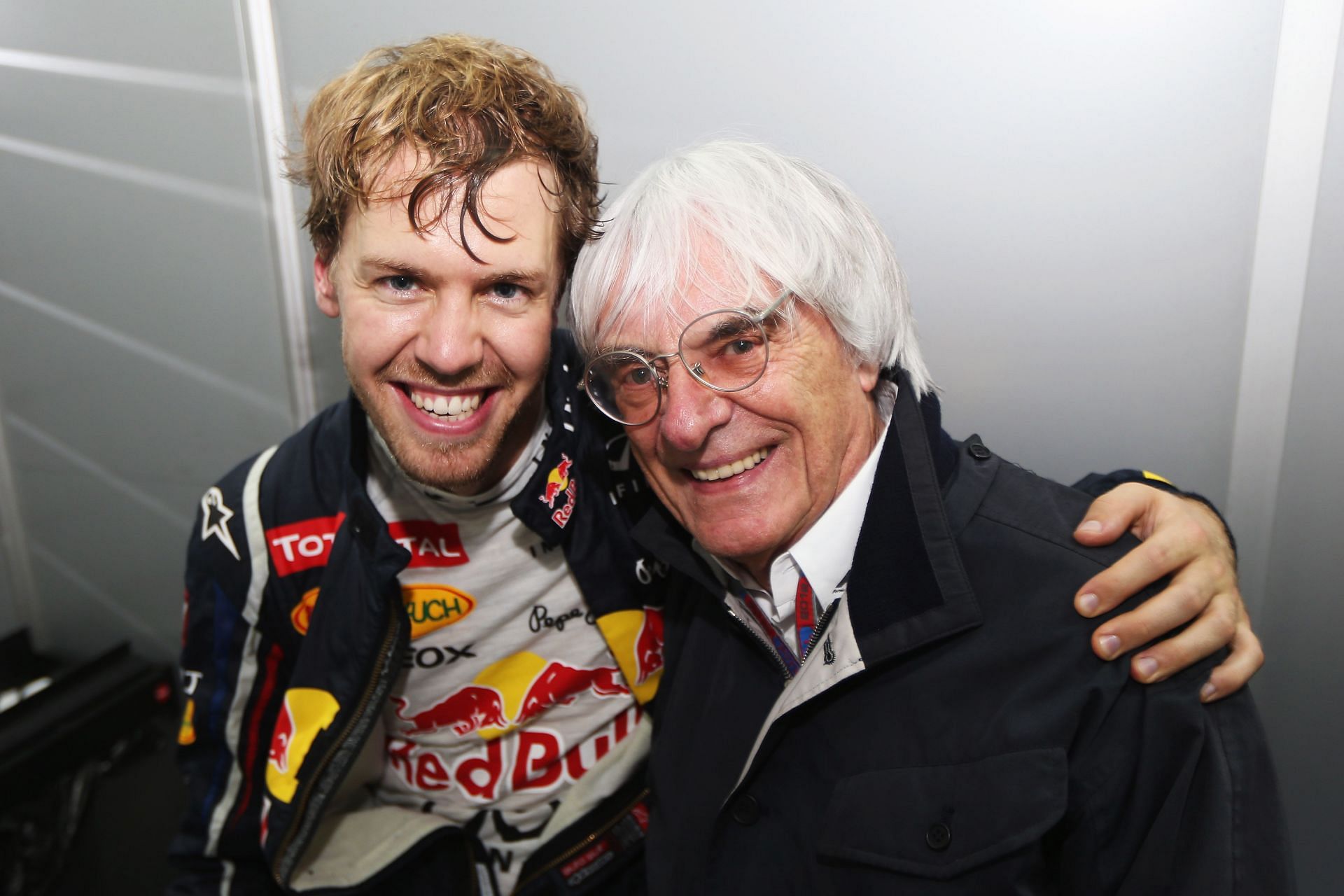 Sebastian Vettel with F1 supremo Bernie Ecclestone after clinching the 2012 title (Photo by Mark Thompson/Getty Images)