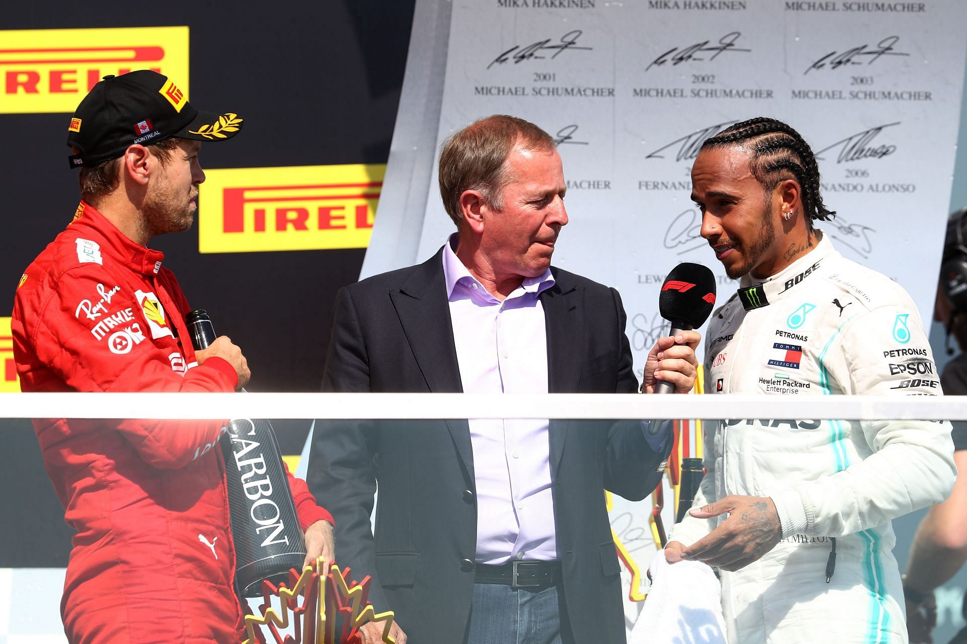 Lewis Hamilton and Martin Brundle on the podium during the Canadian GP. (Photo by Mark Thompson/Getty Images)