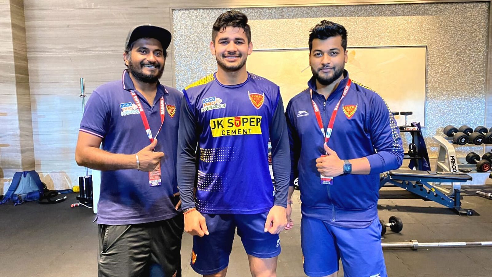 Star Raider Naveen Kumar (C) with Managers Omkar Prabhu (L) and Prem Kishan (R)