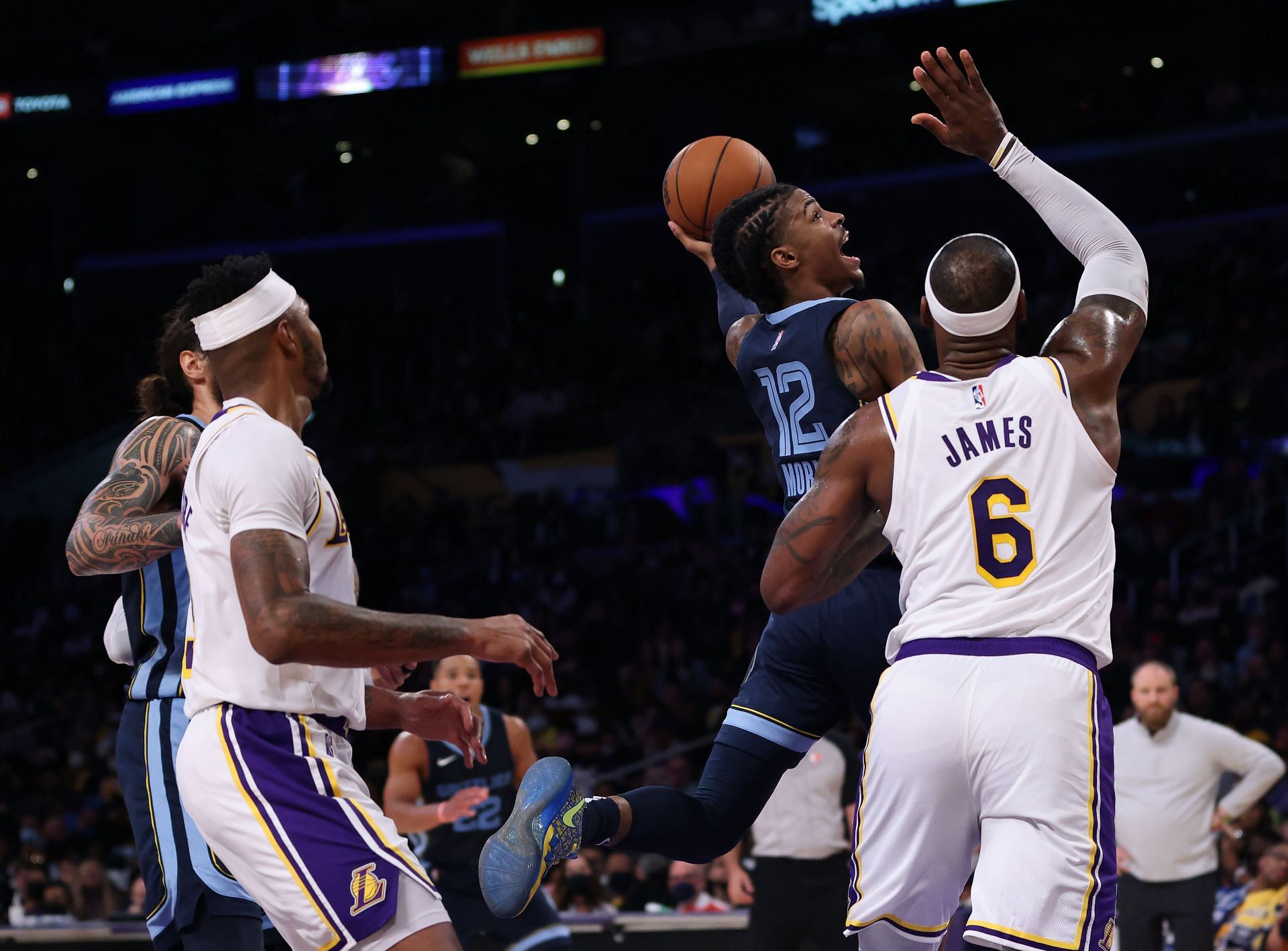 LeBron James defends against Ja Morant during Memphis Grizzlies v LA Lakers