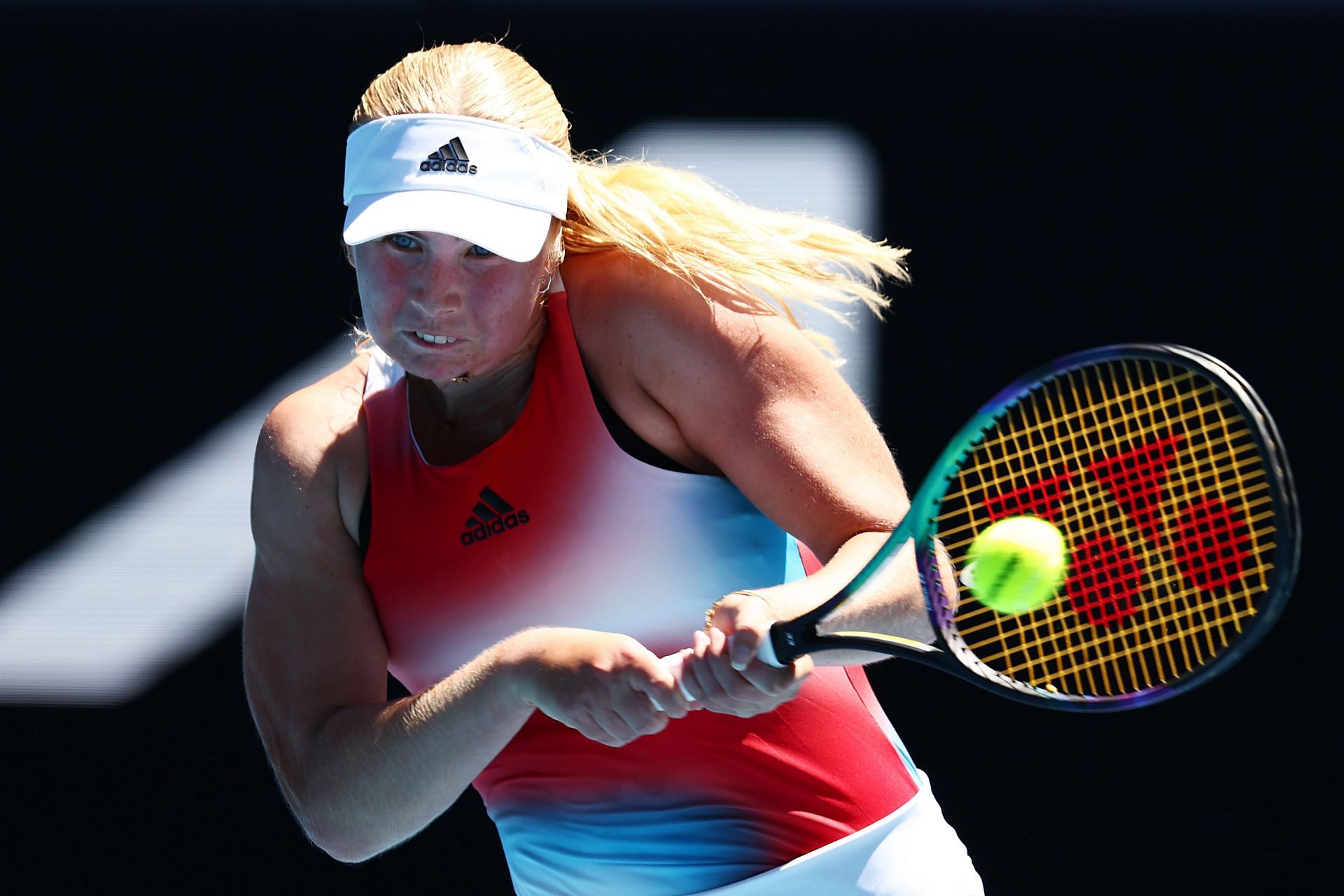 Clara Tauson hits a backhand at 2022 Australian Open