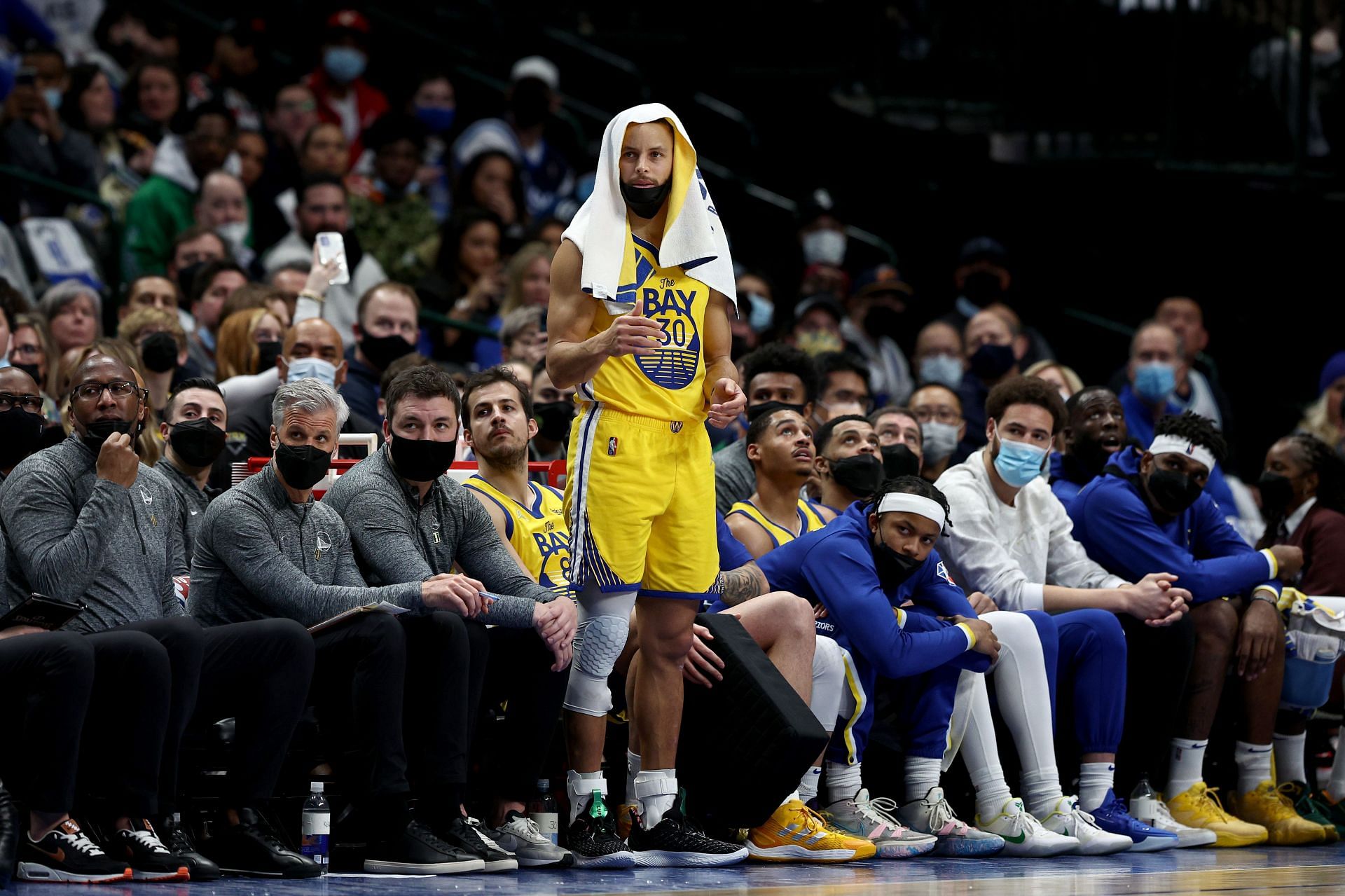 Stephen Curry of the Golden State Warriors reacts from the bench