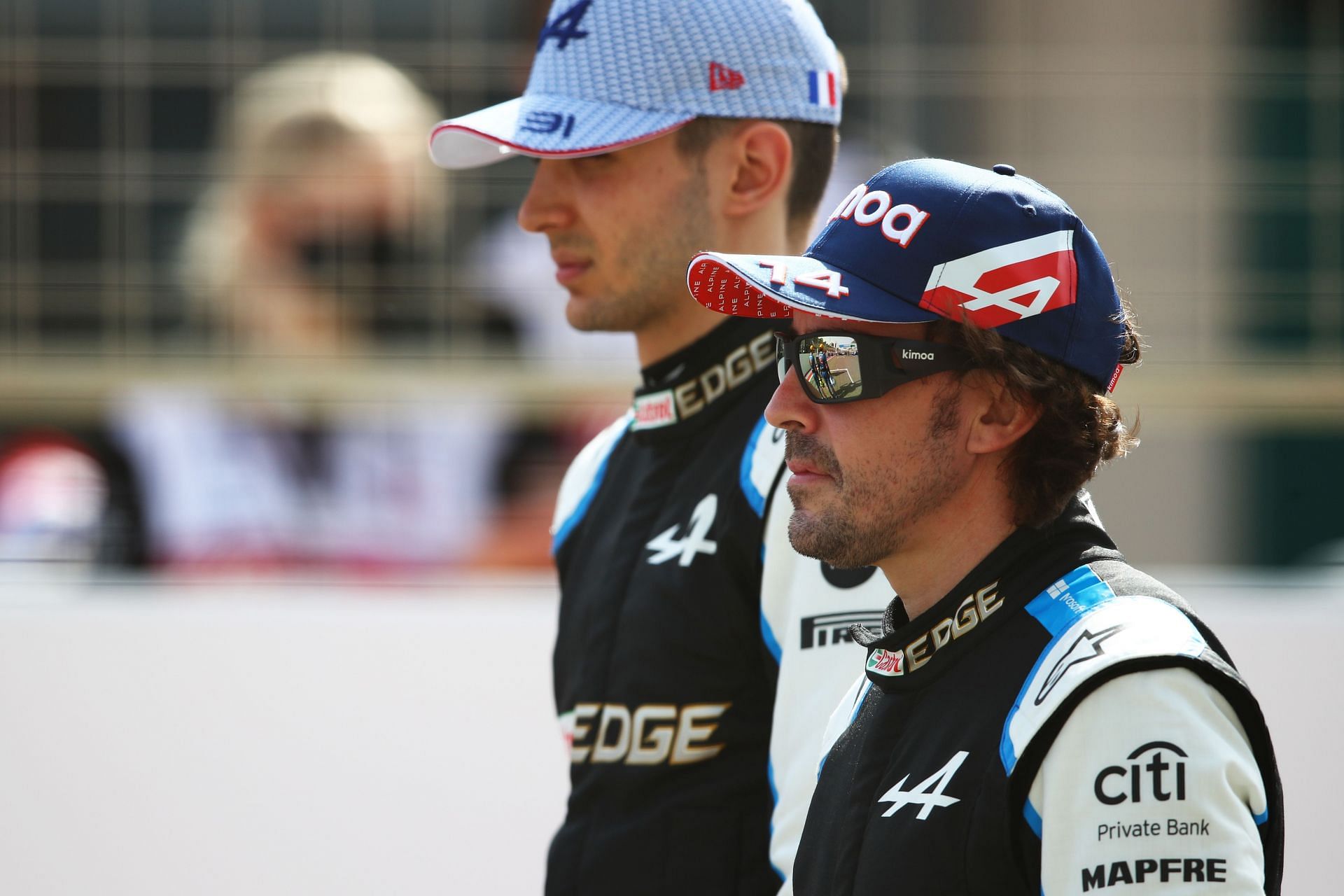 Esteban Ocon and Fernando Alonso stand on the grid. (Photo by Joe Portlock/Getty Images)