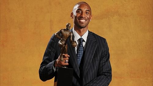 Kobe Bryant with the 2007-08 NBA MVP trophy.