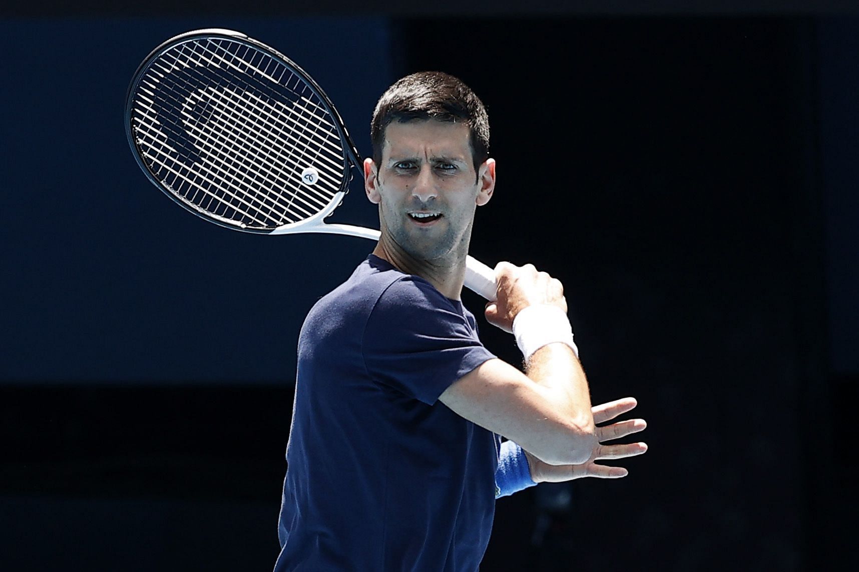 Novak Djokovic practices at the Rod Laver Arena in Melbourne