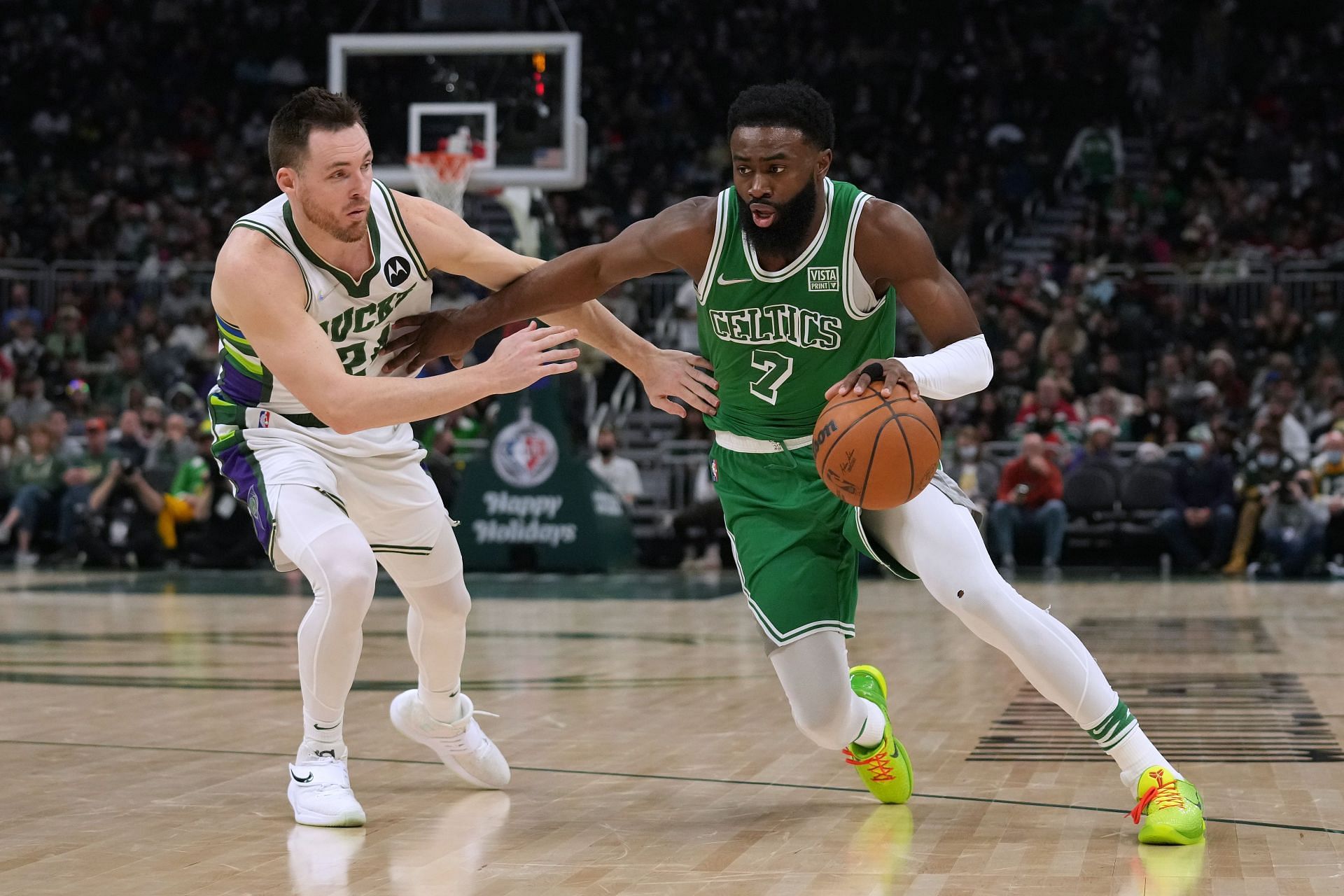 Jaylen Brown attempts to drive past Pat Connaughton.