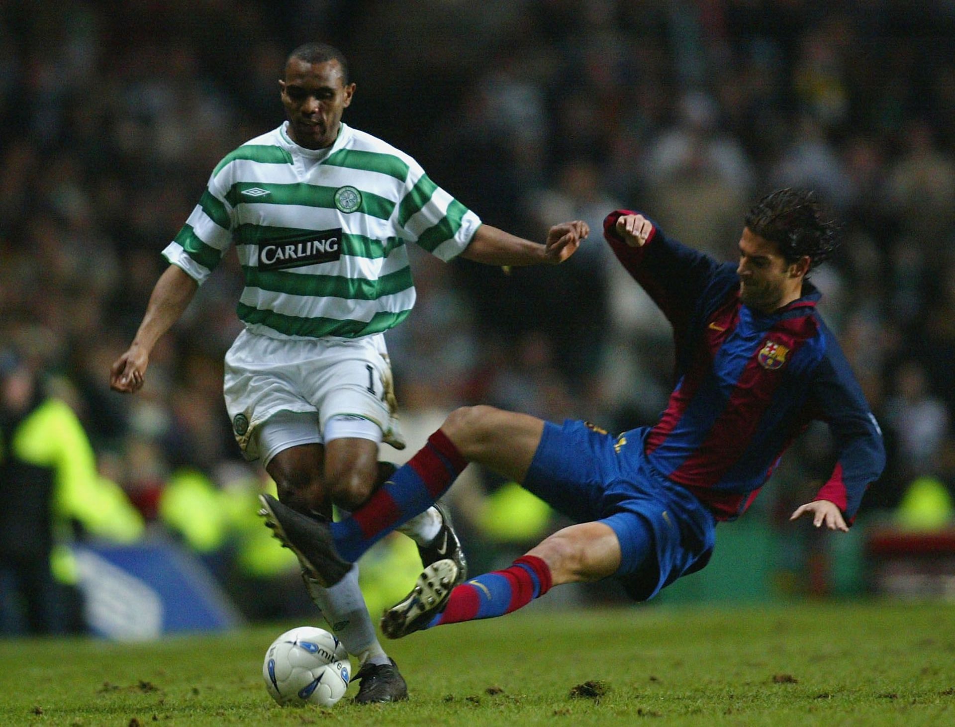 Lopez (right) challenges for the ball in UEFA Cup 4th round game vs Celtic