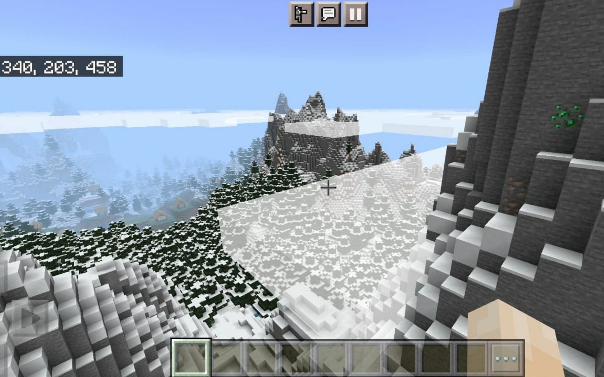 Village hidden in the mountains (Image via Minecraft)