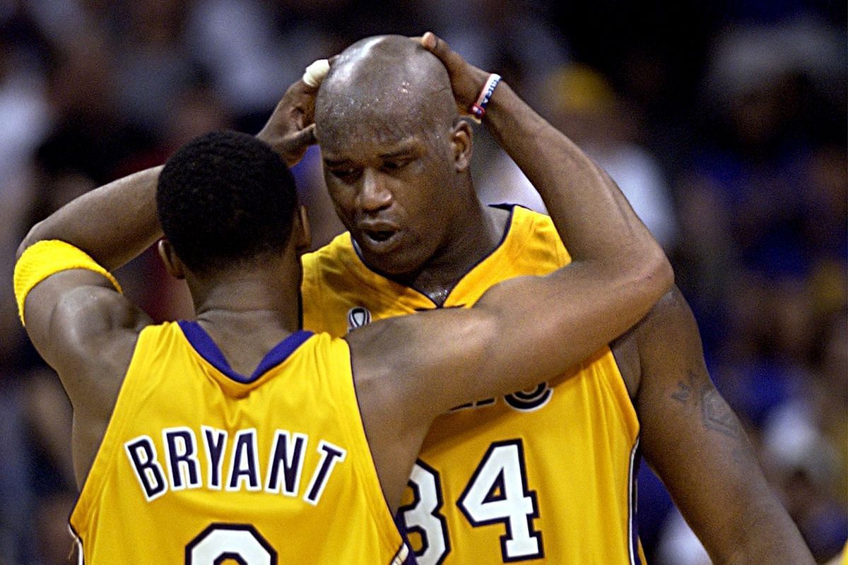 Shaquille O&#039;Neal and Kobe Bryant hug each other during a game. [Photo via Silver Screen and Roll]