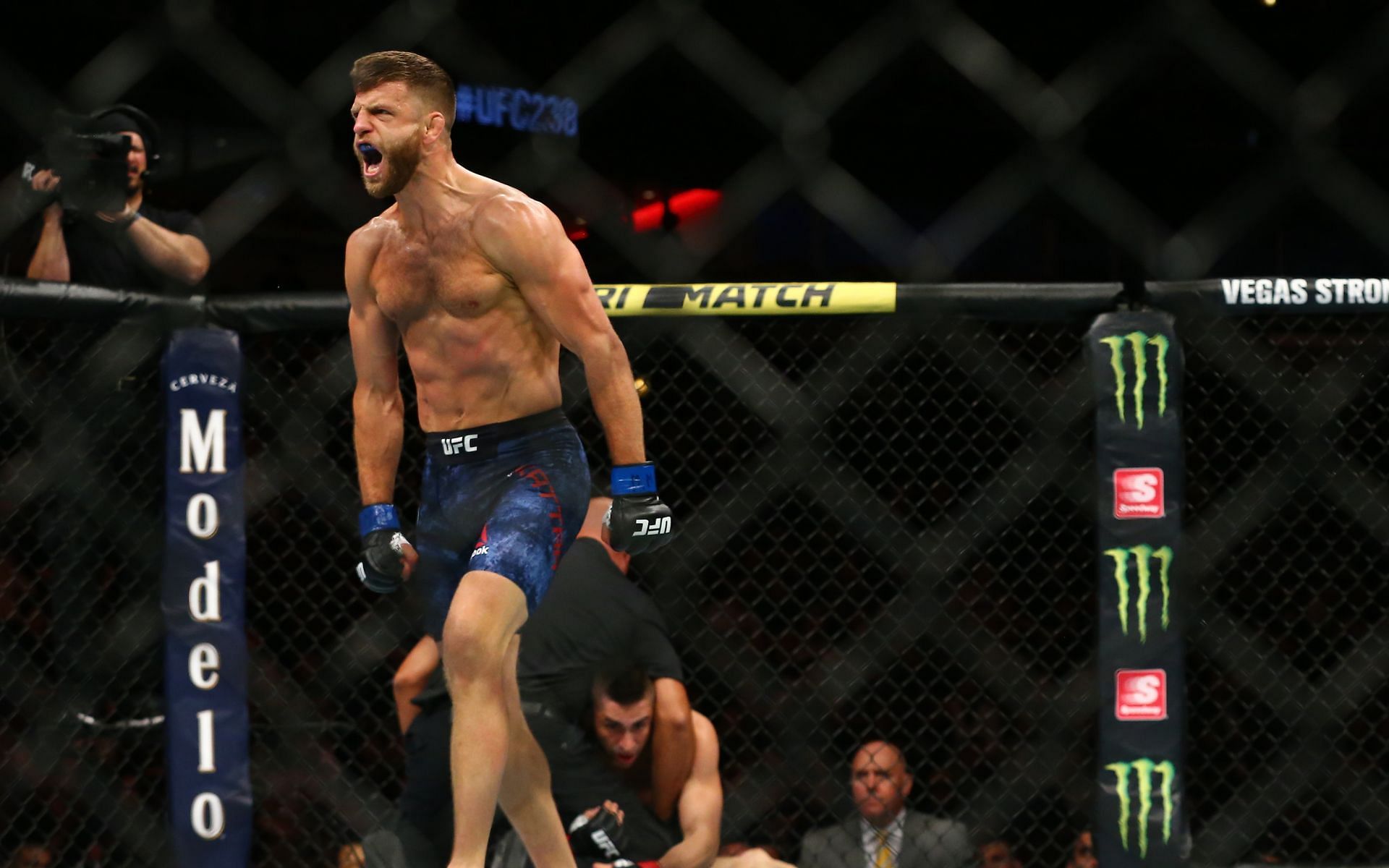 Calvin Kattar (left) celebrates his knock out victory over Ricardo Lamas at UFC 238 in June 2019