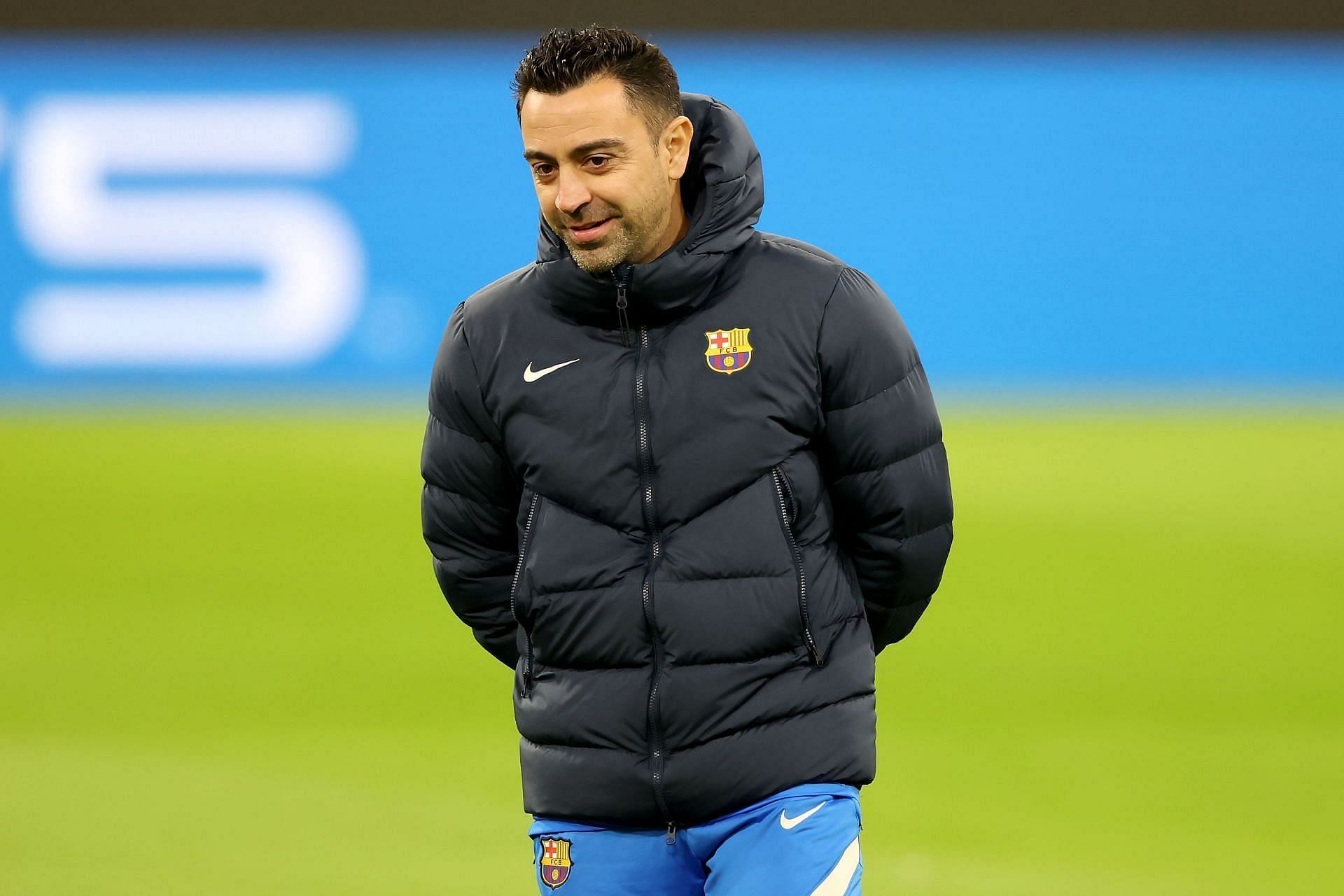 Barcelona manager Xavi Hernandez looks on