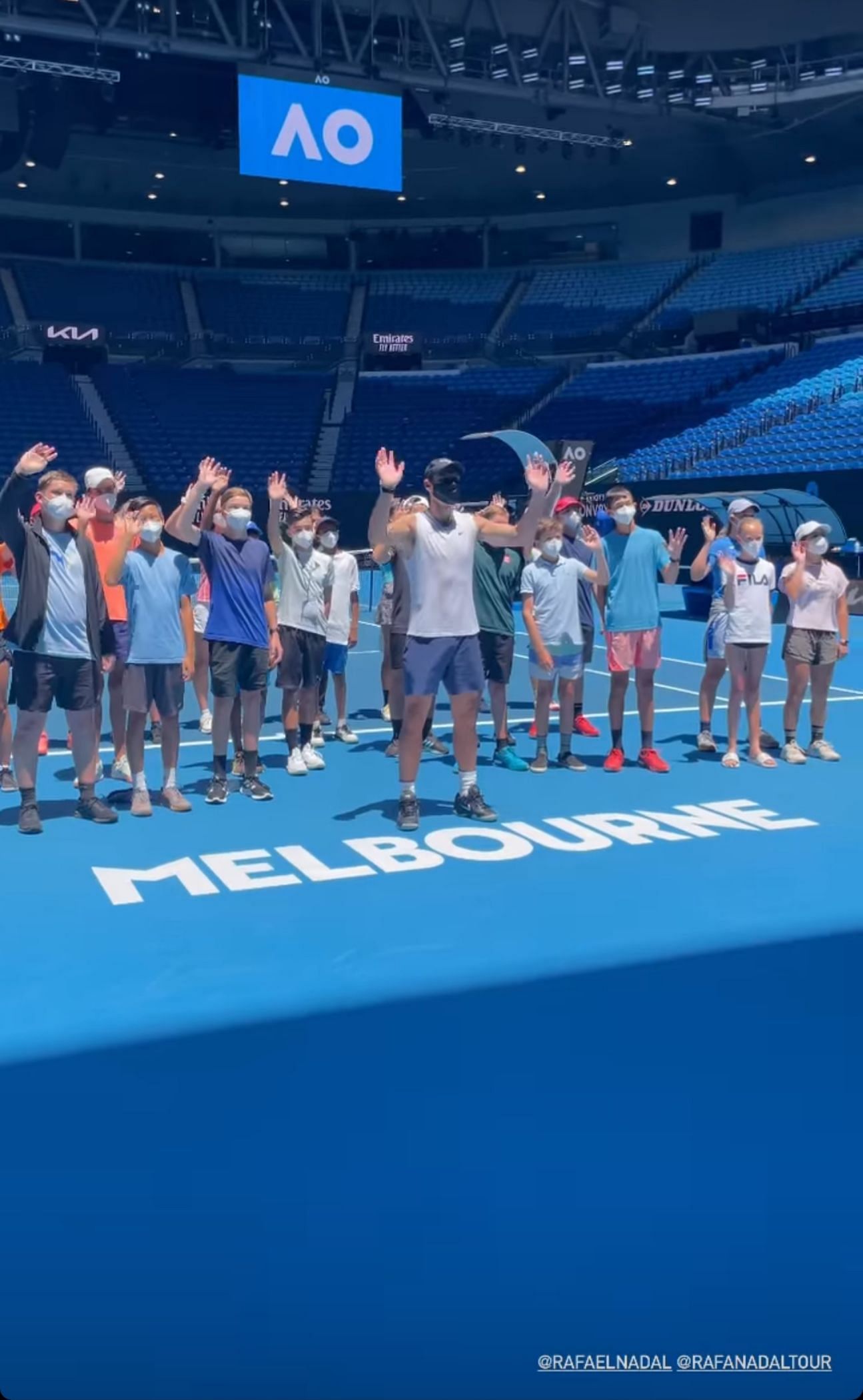 Nadal poses for photos with the kids at the Rod Laver Arena in Melbourne
