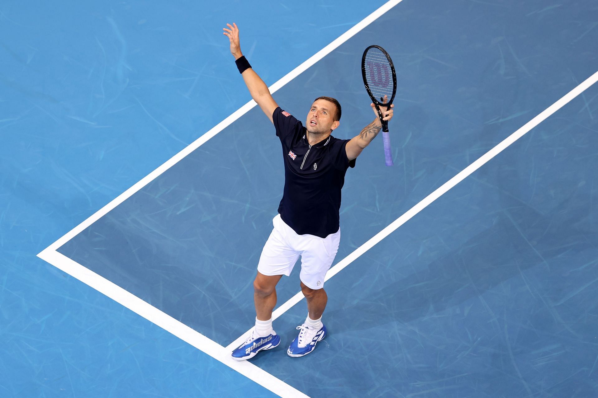 Dan Evans celebrating his victory over John Isner at the 2022 ATP Cup: Day 6