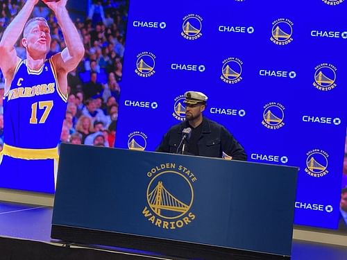 Klay Thompson giving a postgame interview wearing his Captain hat