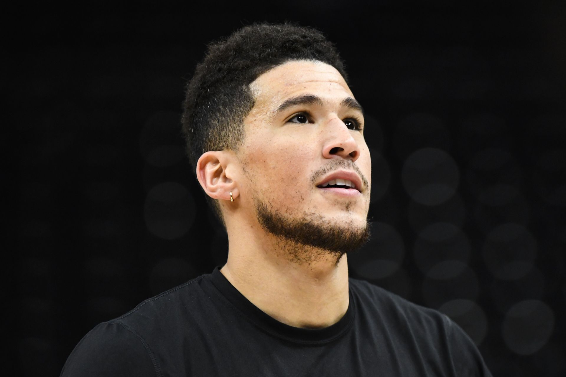 Devin Booker of the Phoenix Suns warms up pregame