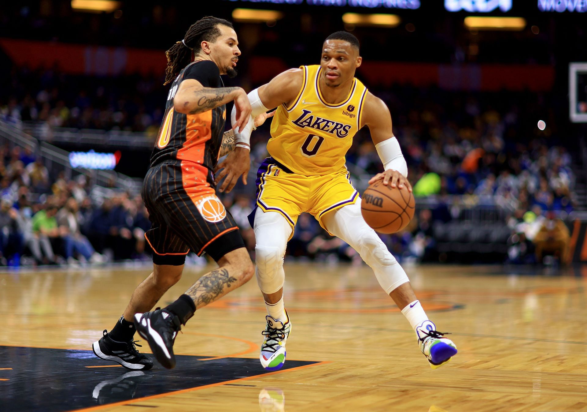 Russell Westbrook #0 of the Los Angeles Lakers drives on Cole Anthony #50 of the Orlando Magic