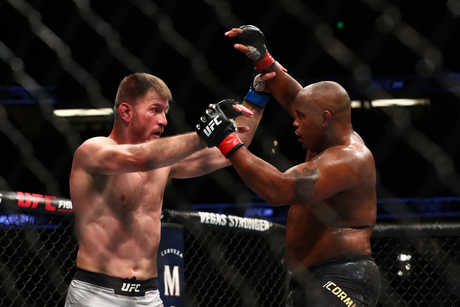 Stipe Miocic (left) and Daniel Cormier (right)