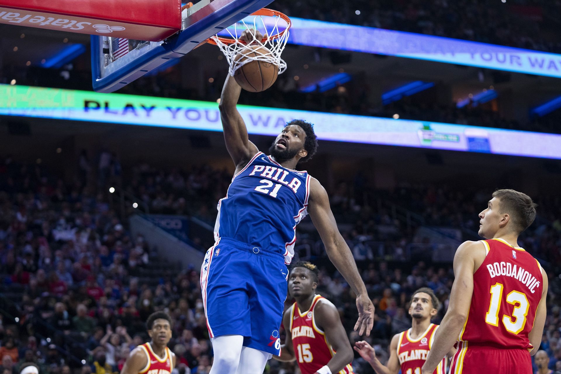 Joel Embiid scores off a dunk